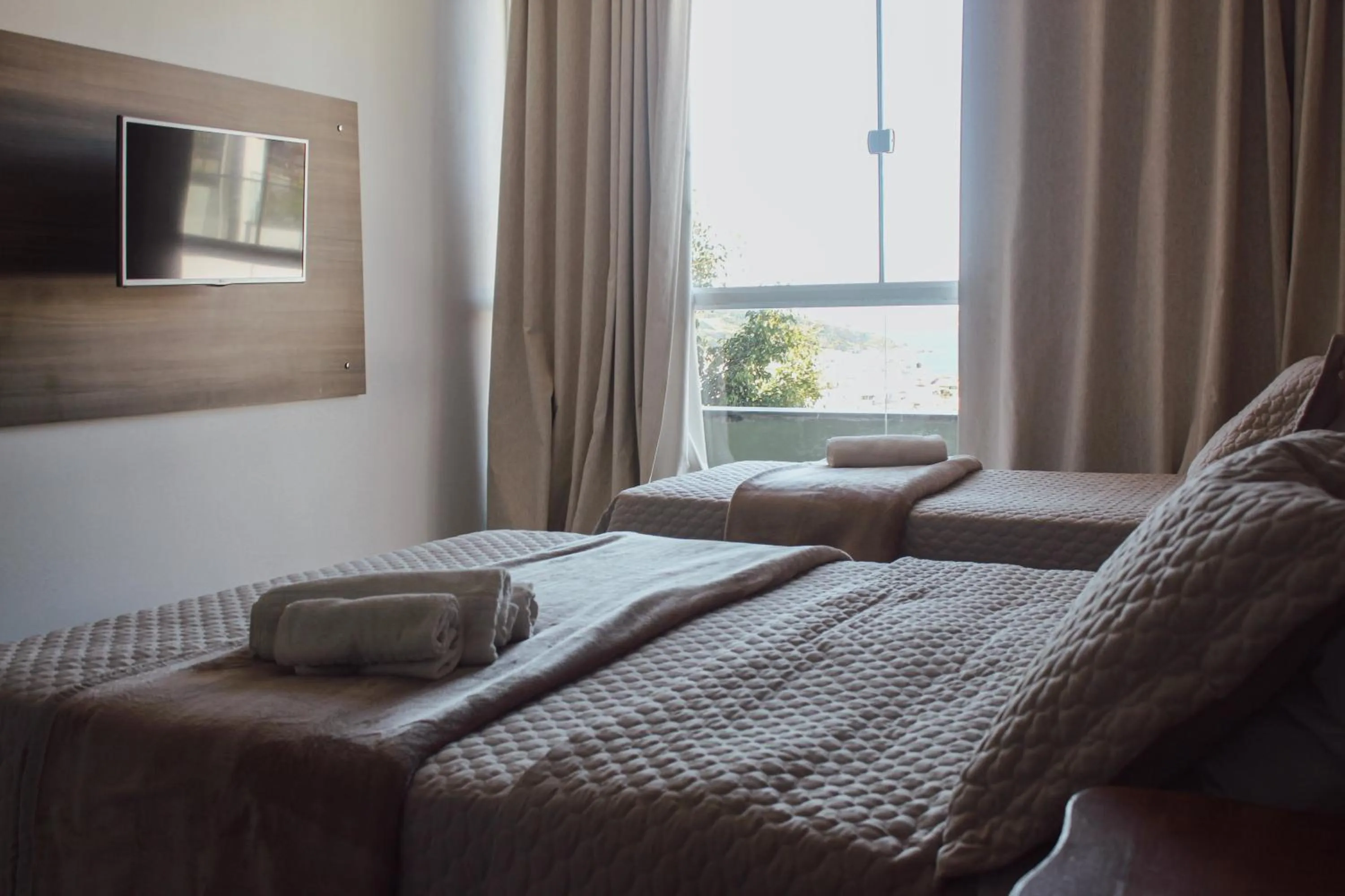 Bed in Pousada Xerxes