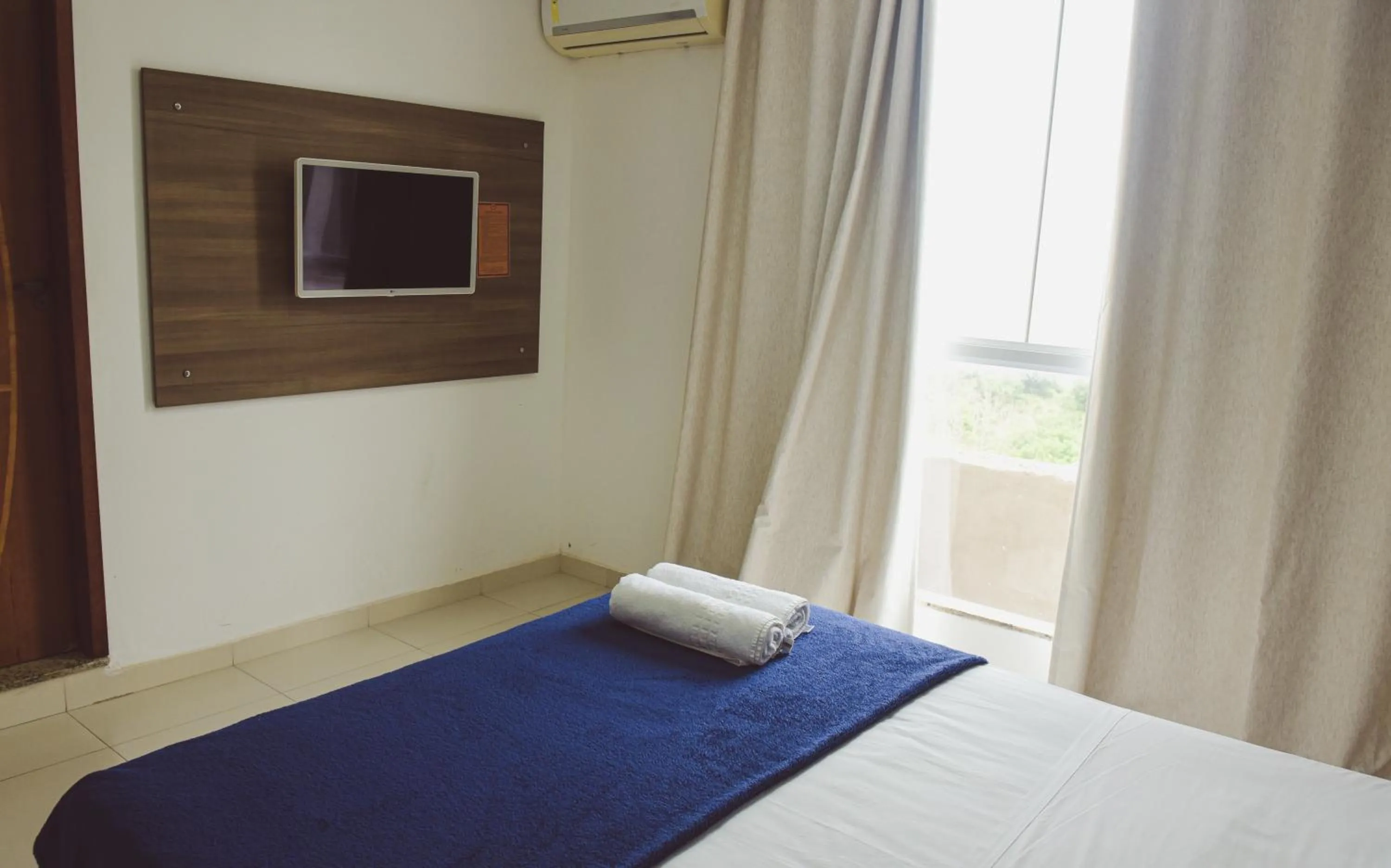 Bed in Pousada Xerxes