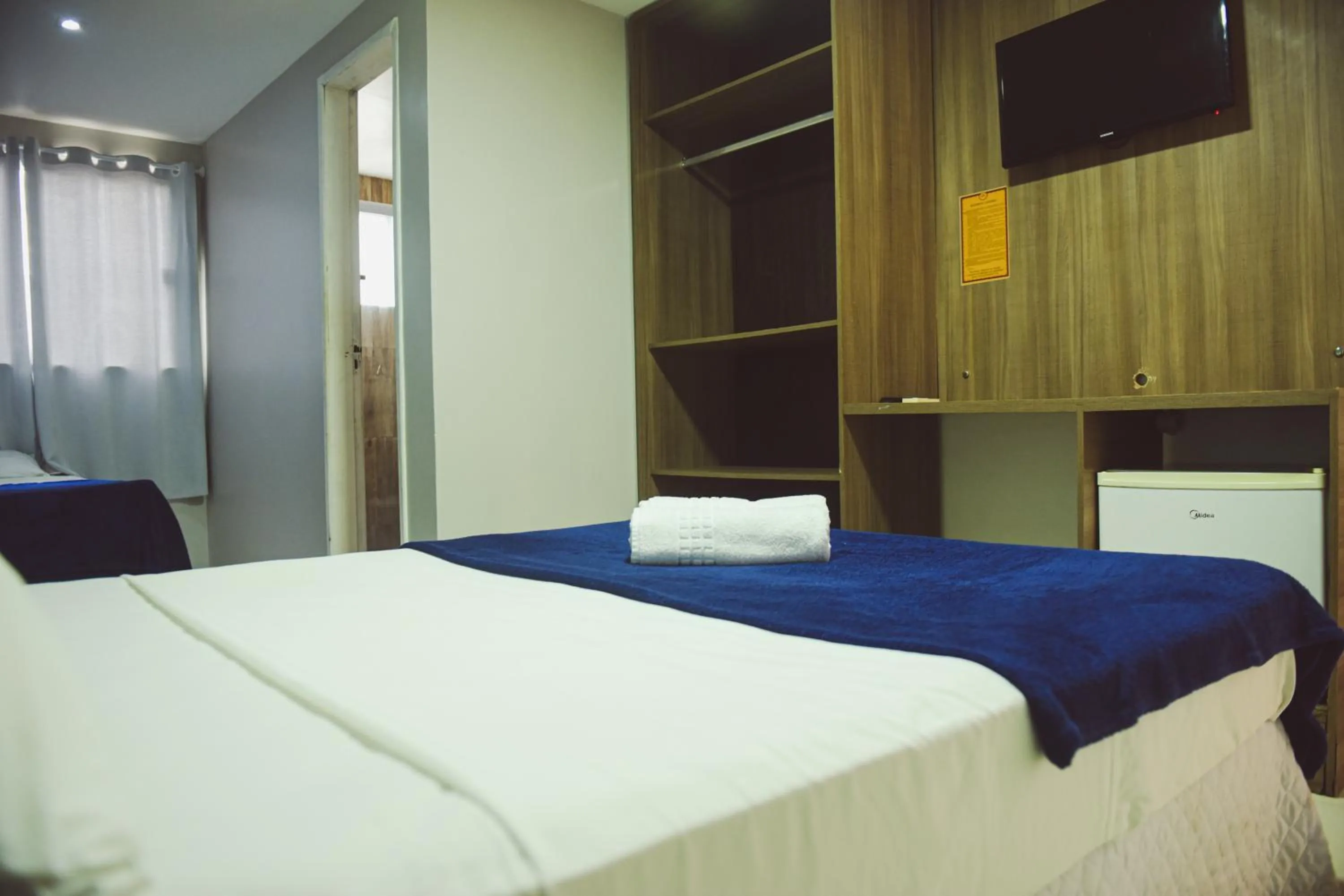 Bed in Pousada Xerxes