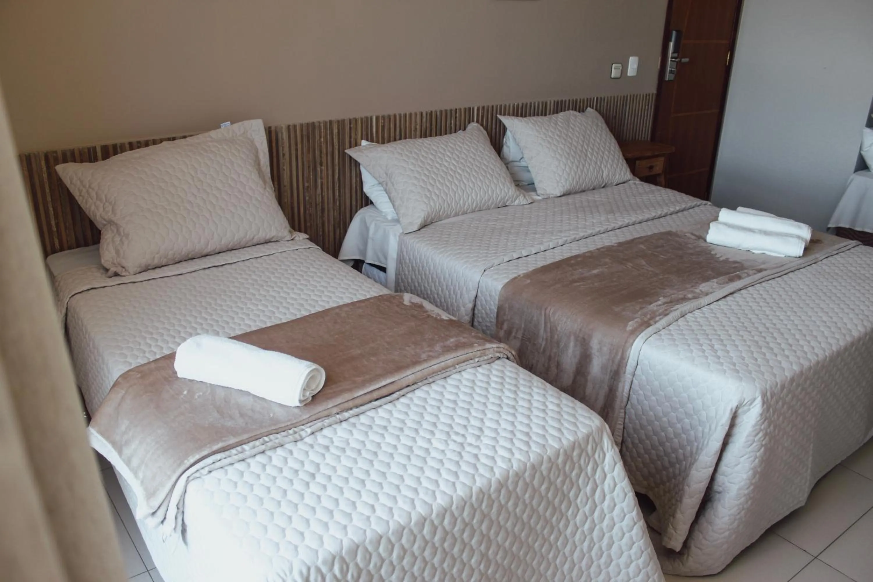 Bed in Pousada Xerxes