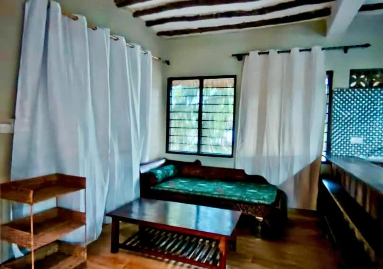 Photo of the whole room, Bed in The Tropinest bungalow