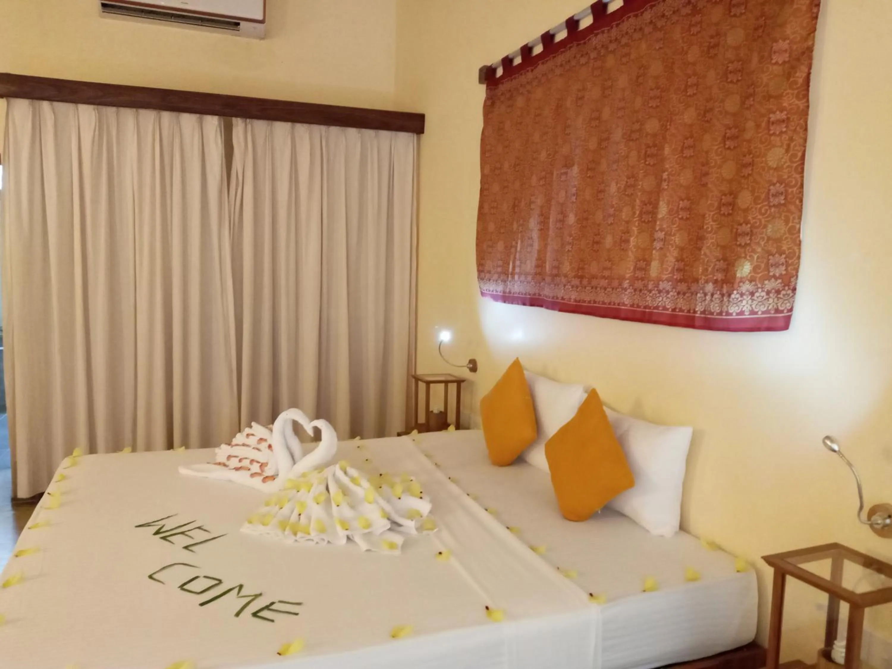 Bed in Giman Free Beach Resort Pasikuda