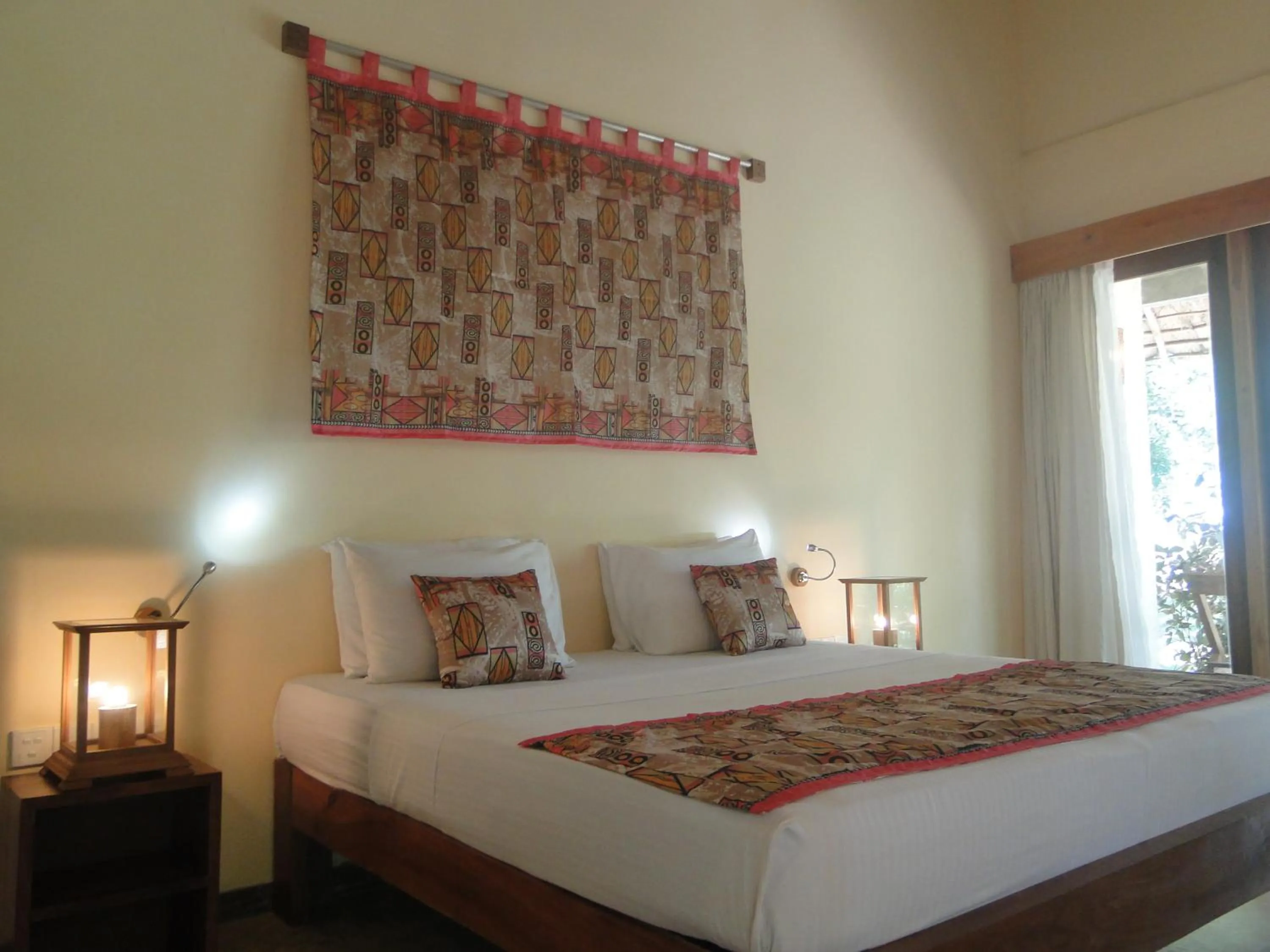 Bed in Giman Free Beach Resort Pasikuda