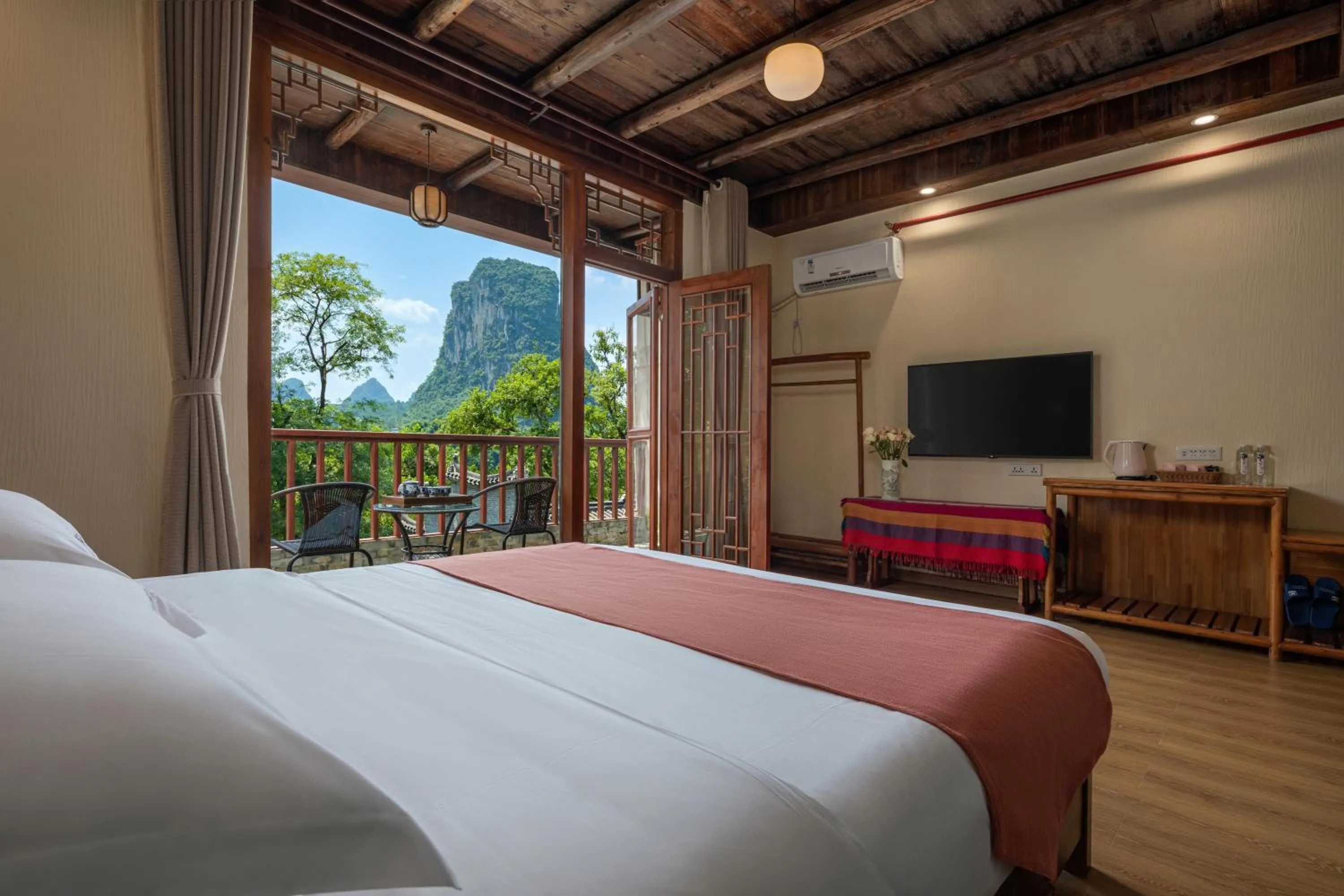 Photo of the whole room, Bed in Yangshuo River Lodge Hotel - Airport or TS Free pick up over 3 nights