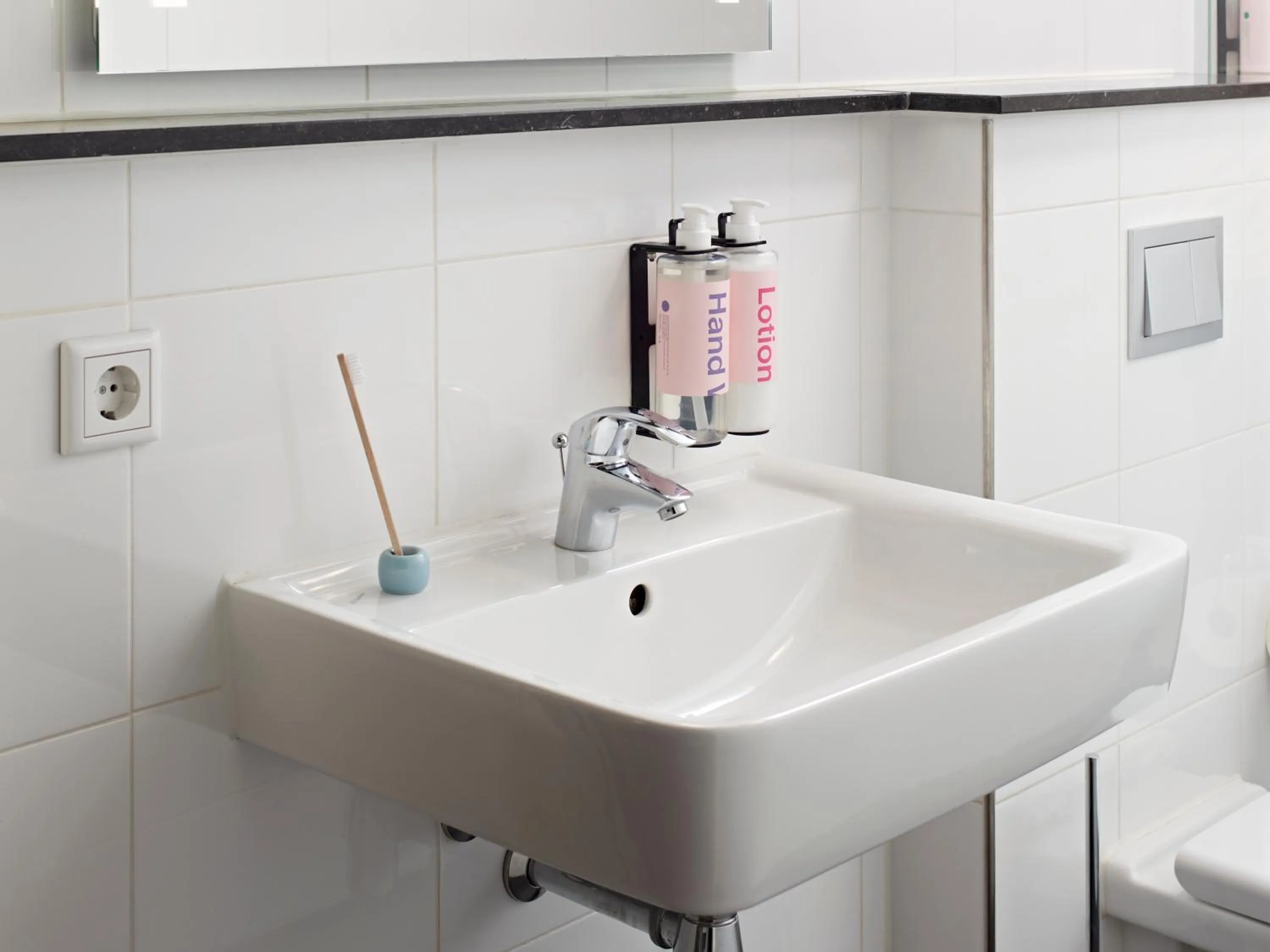 Bathroom in YAYS Amsterdam Maritime by Numa