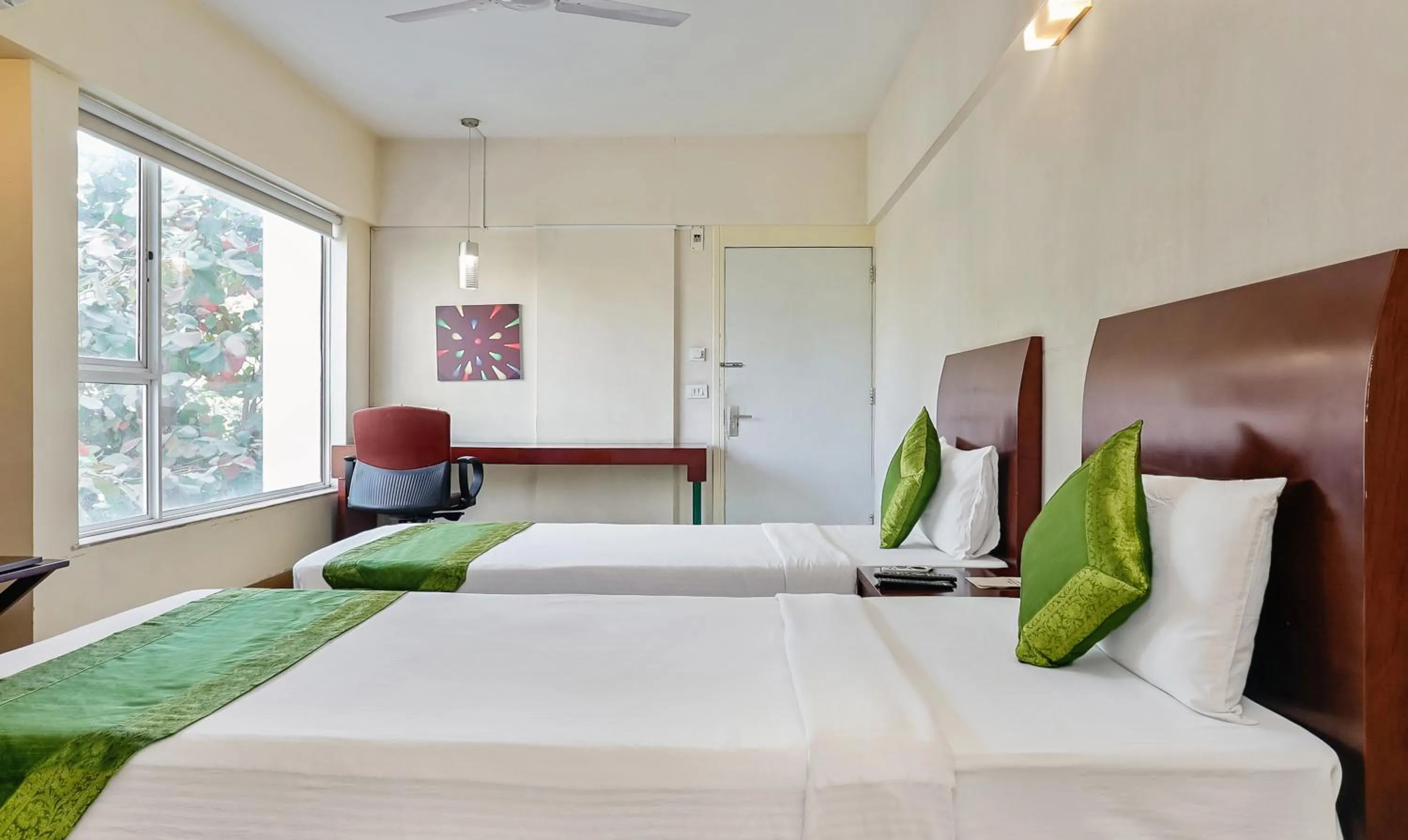 Bedroom, Bed in Treebo Brooks Manor