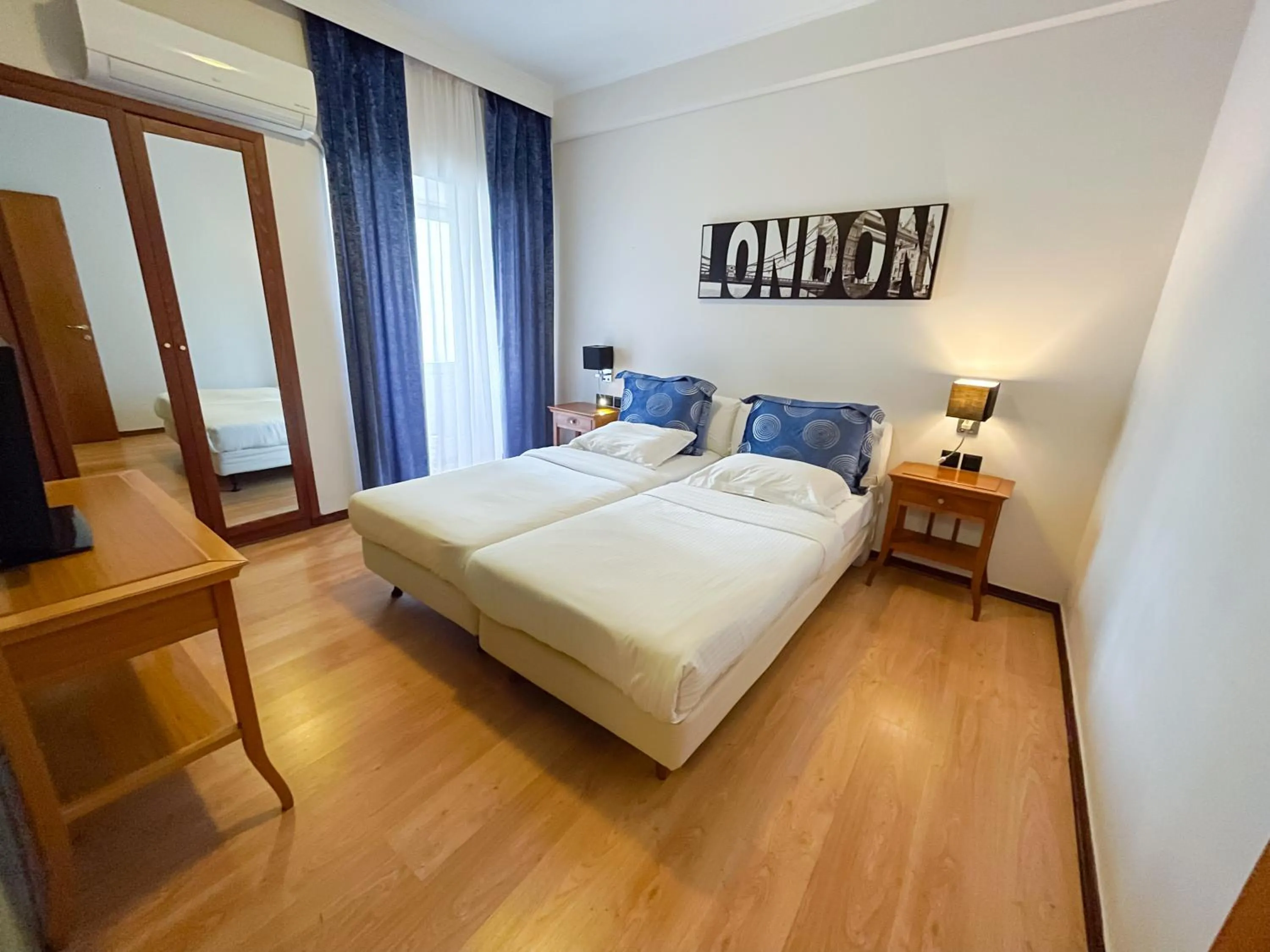 Bed in Andromeda Suites