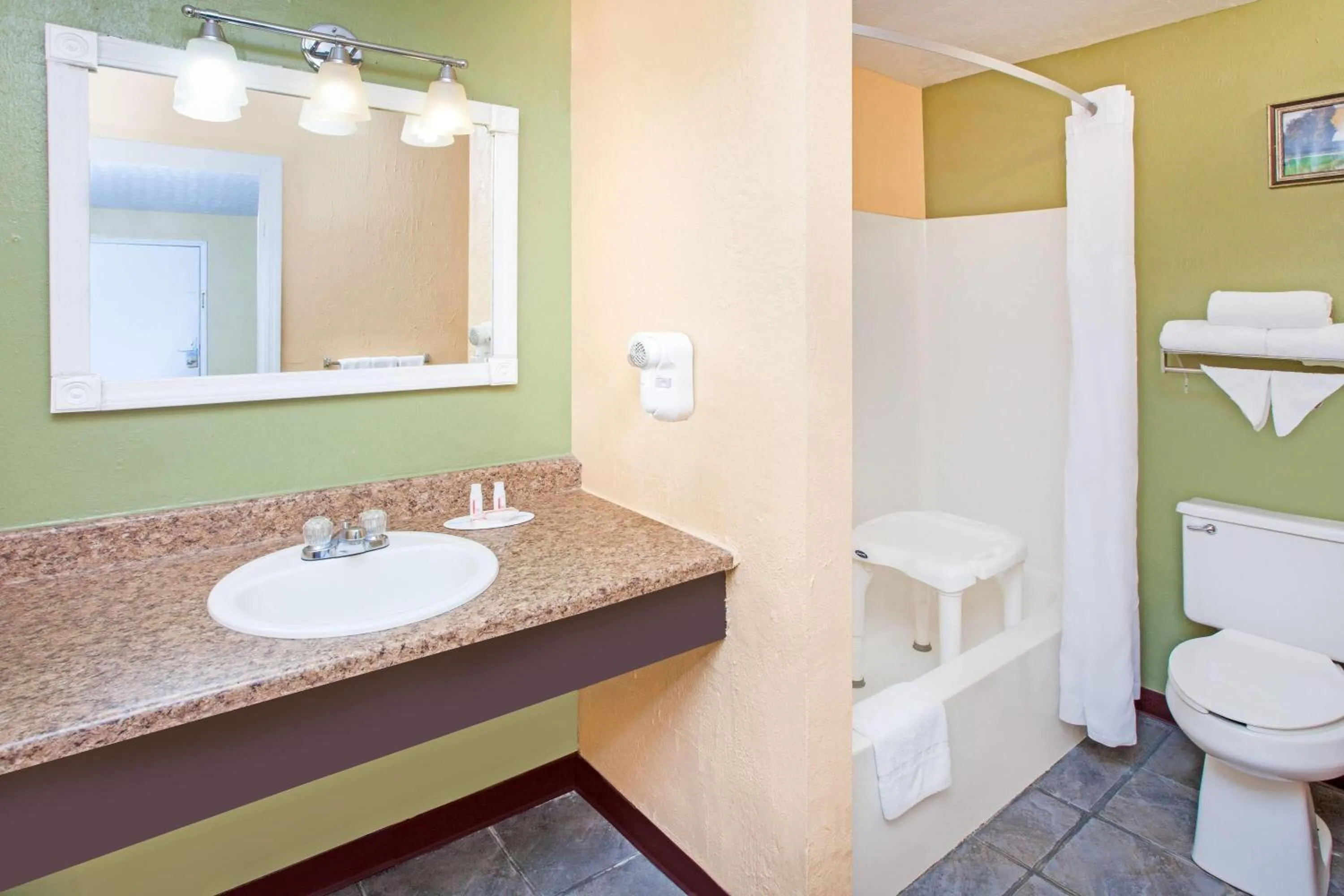 Bathroom in Days Inn & Suites by Wyndham Terre Haute