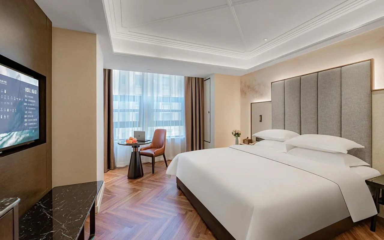 Bed in Metropolo Hotel Xuzhou High-speed Railway Station Jinlonghu