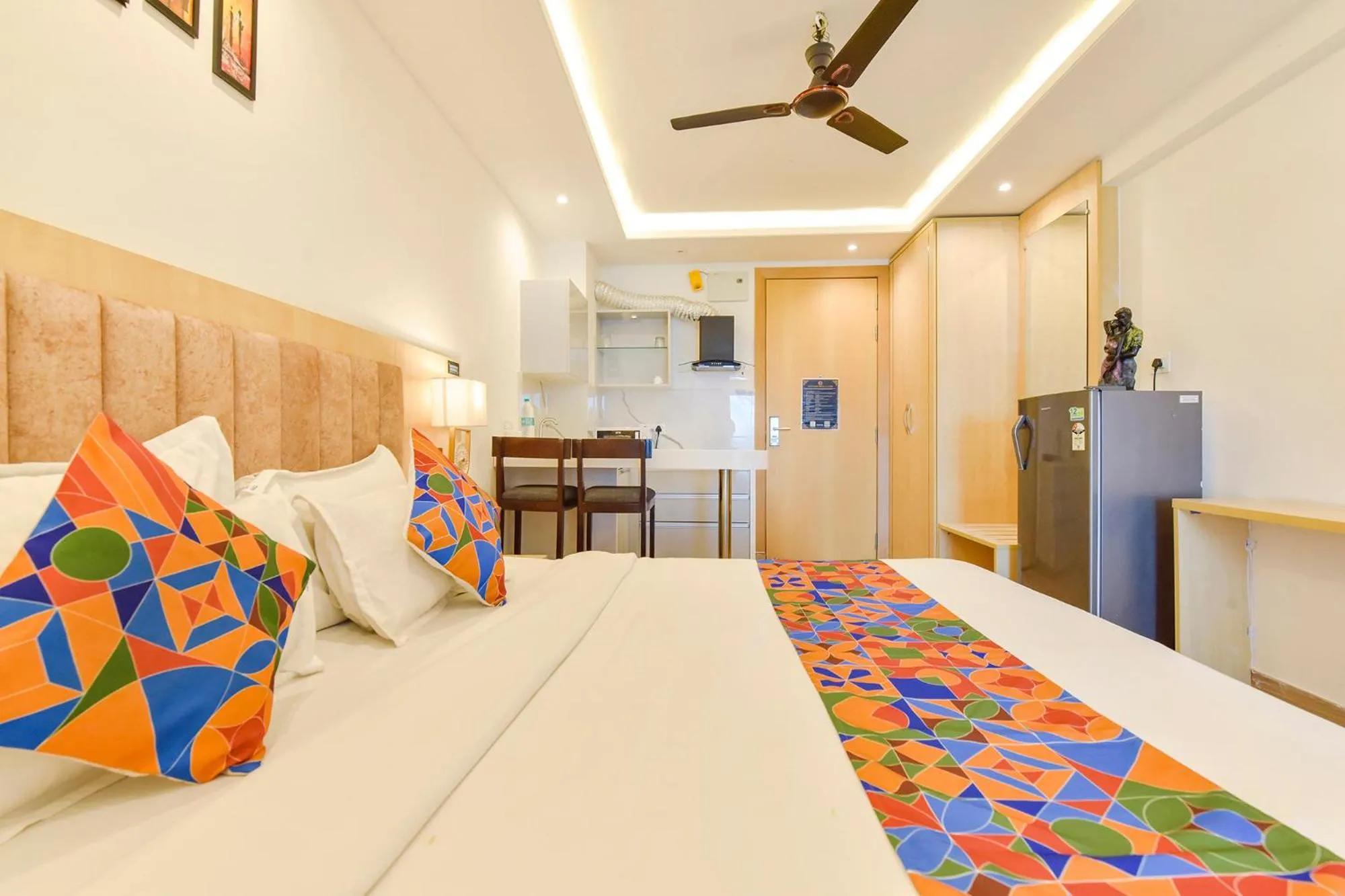 Bed in FabHotel Anukampa With Swimming Pool