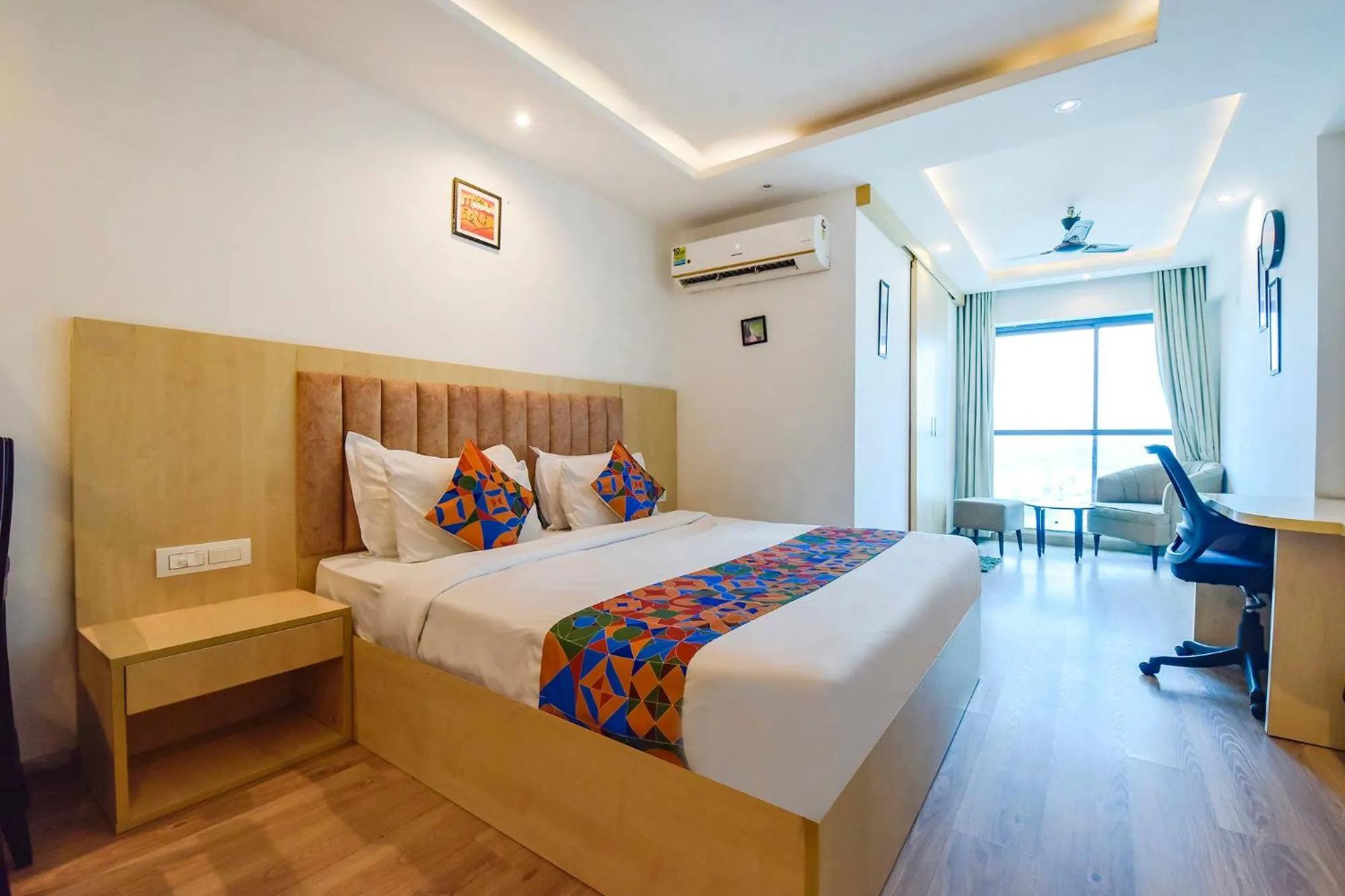 Bed in FabHotel Anukampa With Swimming Pool