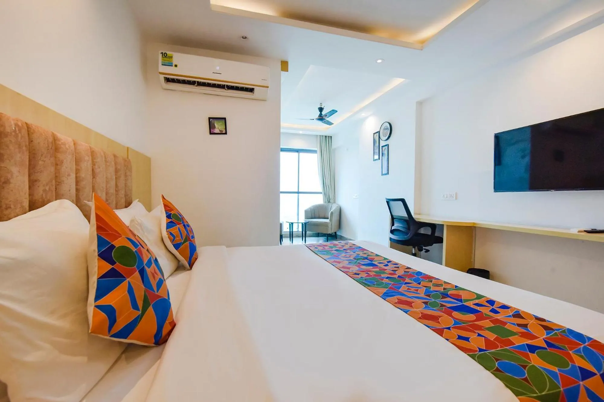 Bed in FabHotel Anukampa With Swimming Pool