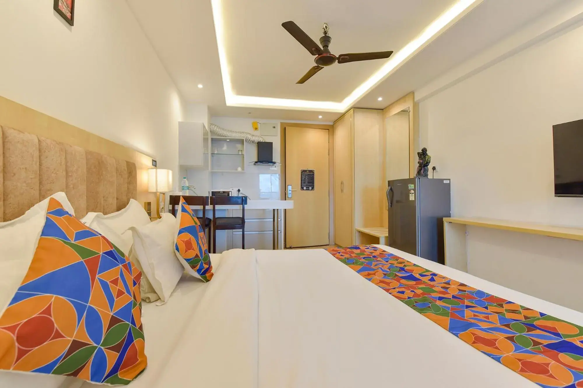 Bed in FabHotel Anukampa With Swimming Pool Bed in FabHotel Anukampa With Swimming Pool