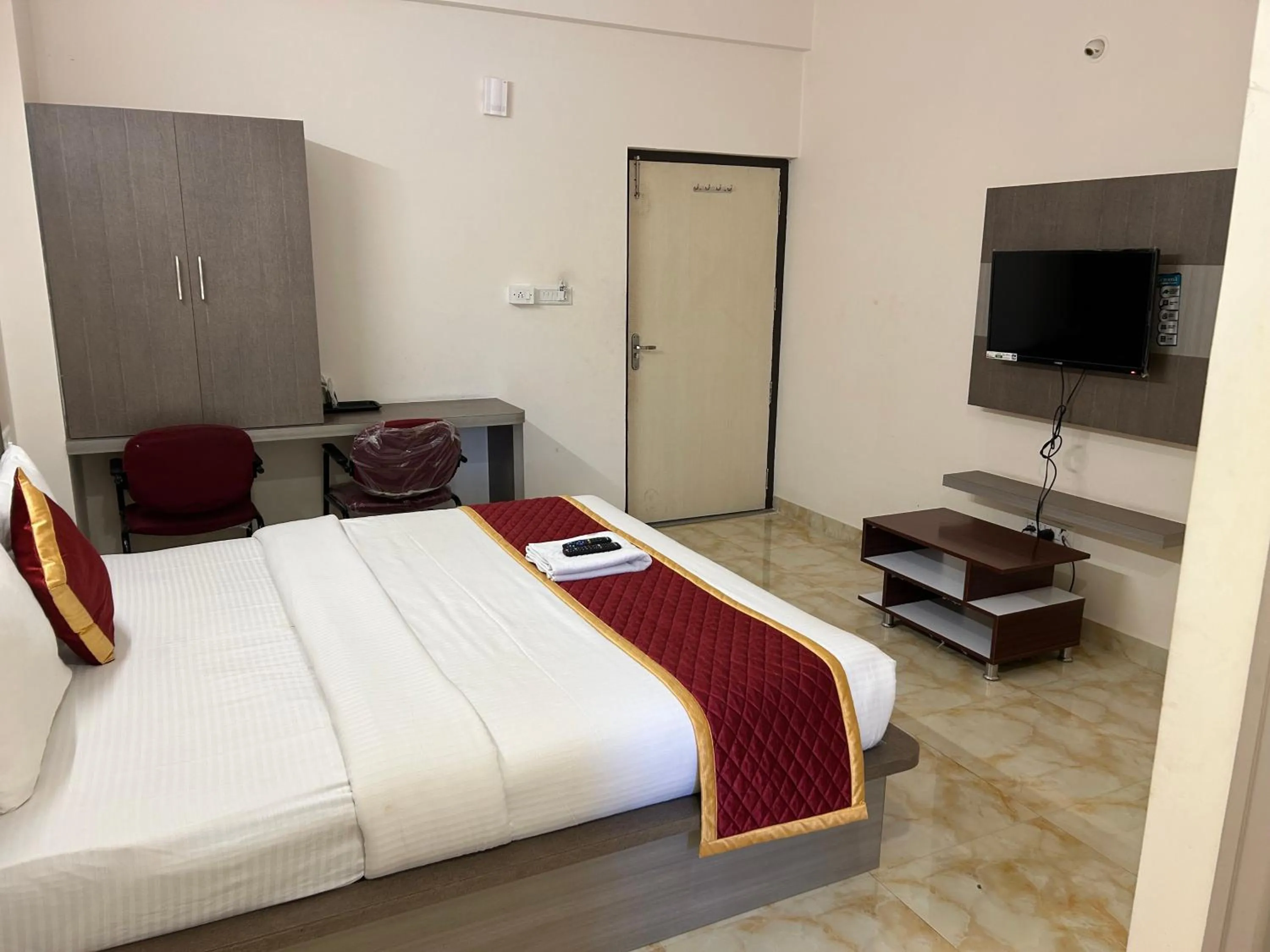 Photo of the whole room, Bed in M S Comforts