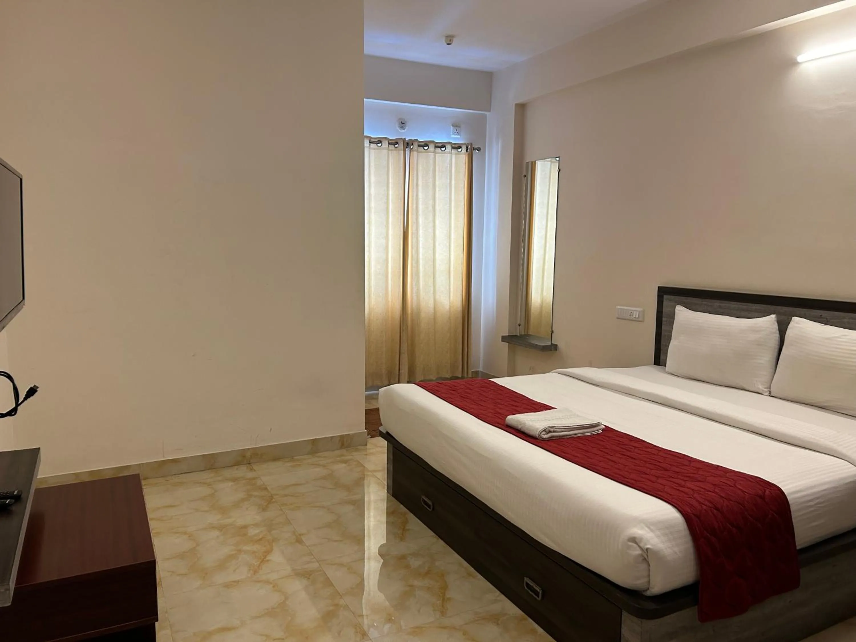 Photo of the whole room, Bed in M S Comforts