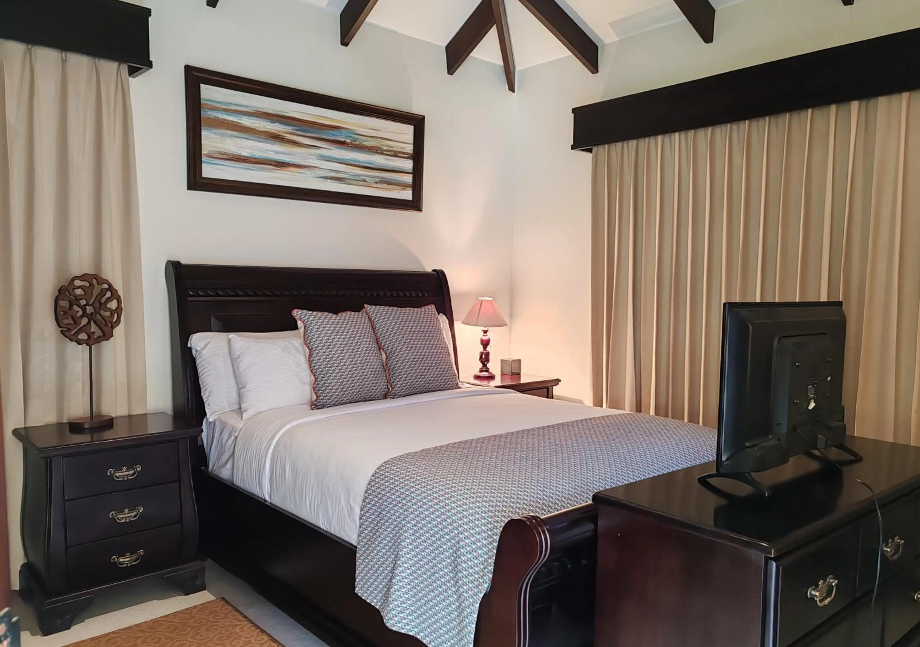 Bed in Marenaz Oceanfront Resort