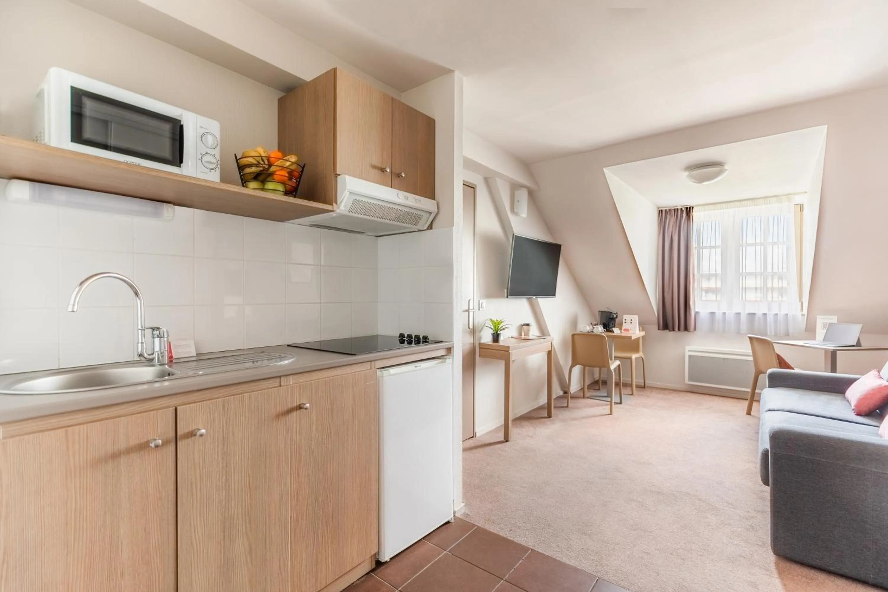 Kitchen or kitchenette in Appart’City Confort Reims Centre