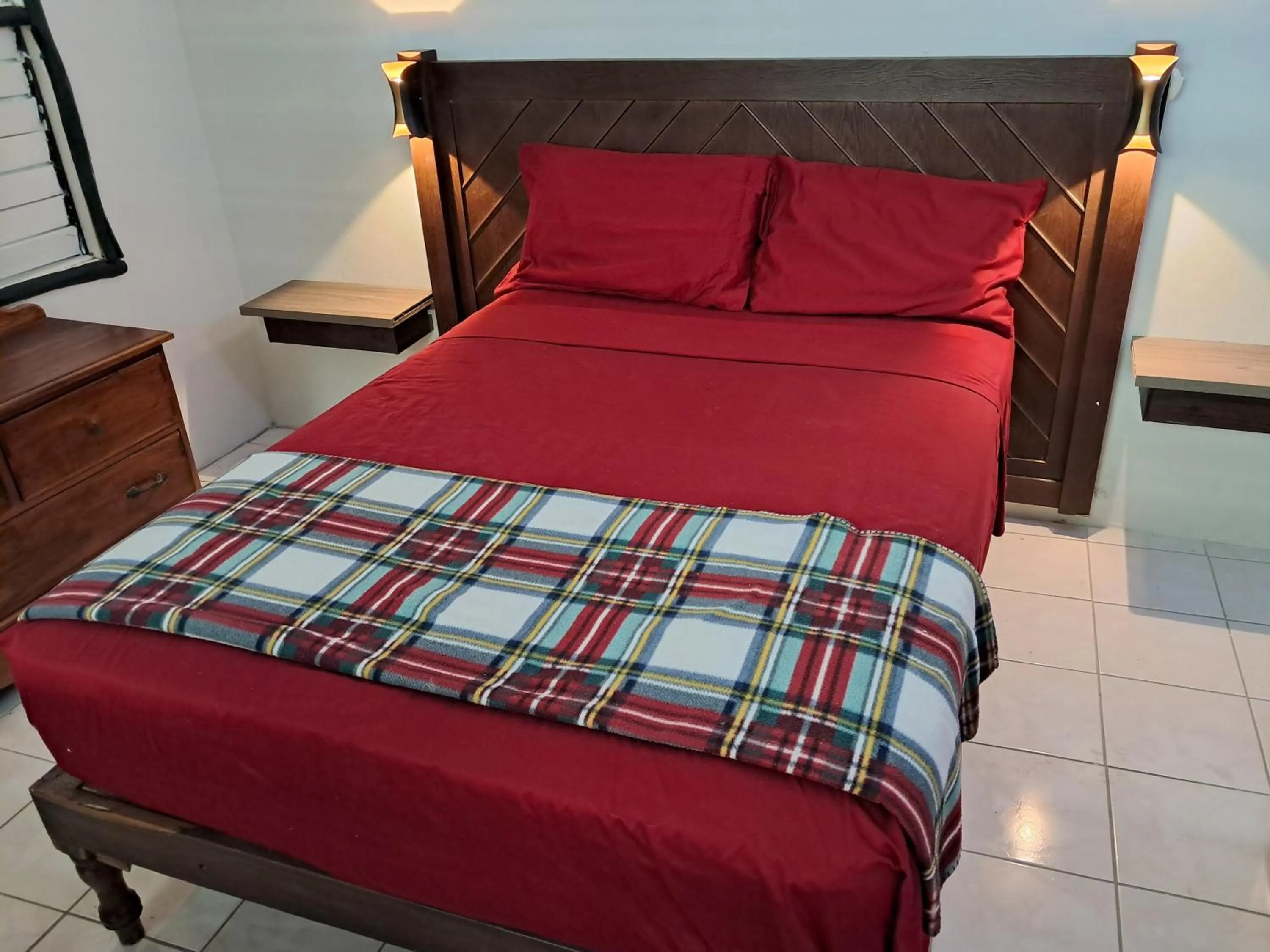 Bed in Barry's Rooms Negril