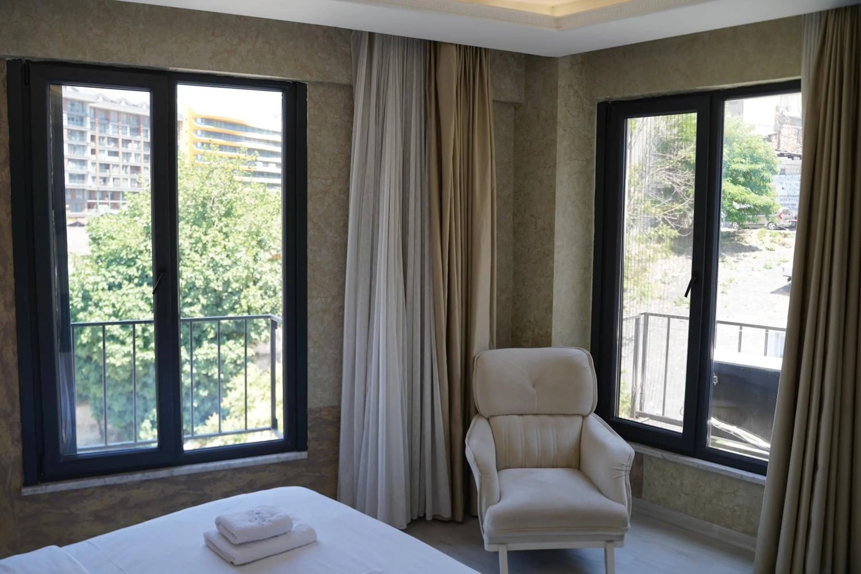 Seating area, Bed in Sword Suit Hotel