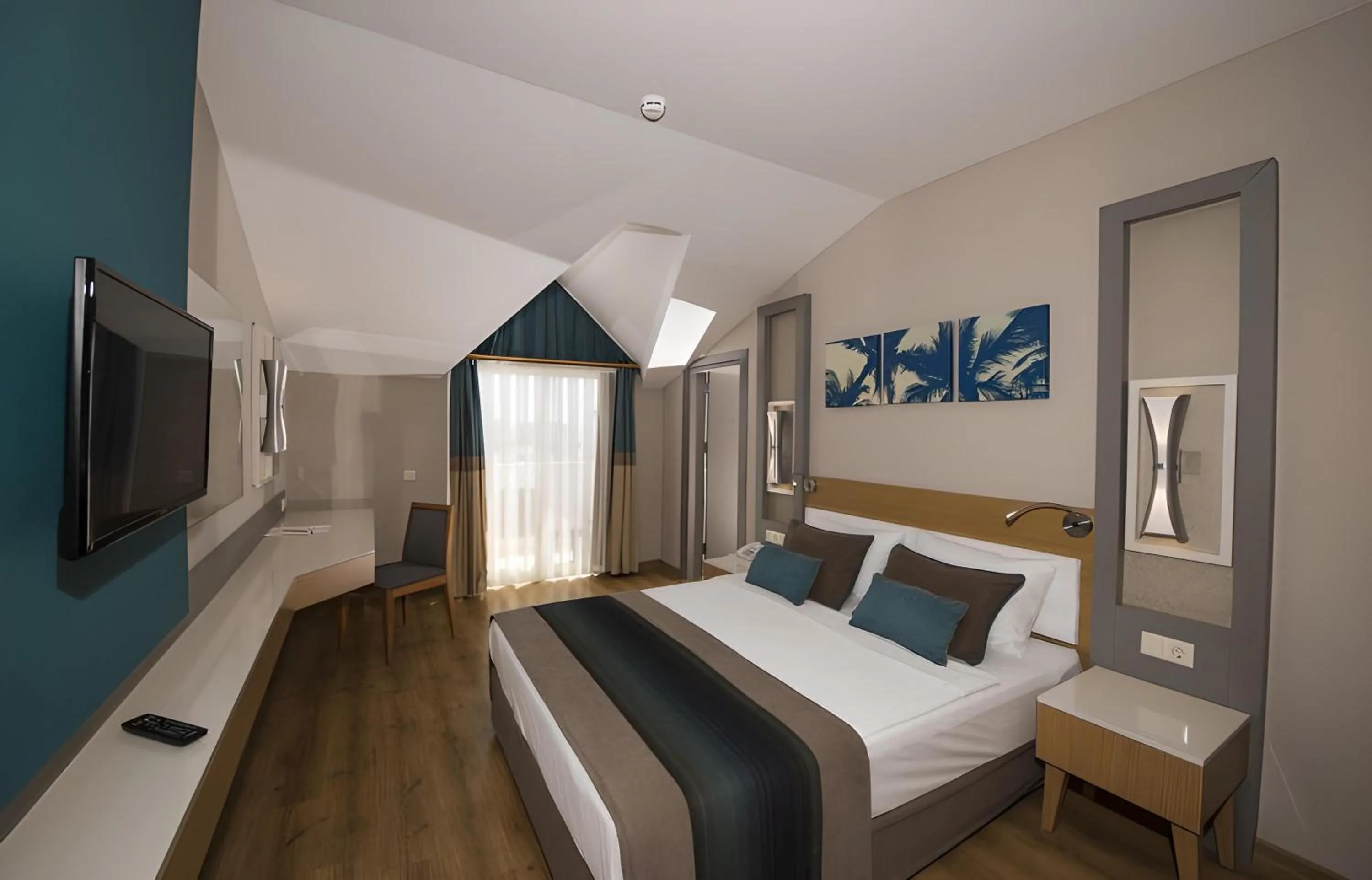 Bed in Palm World Side Resort &amp; Spa