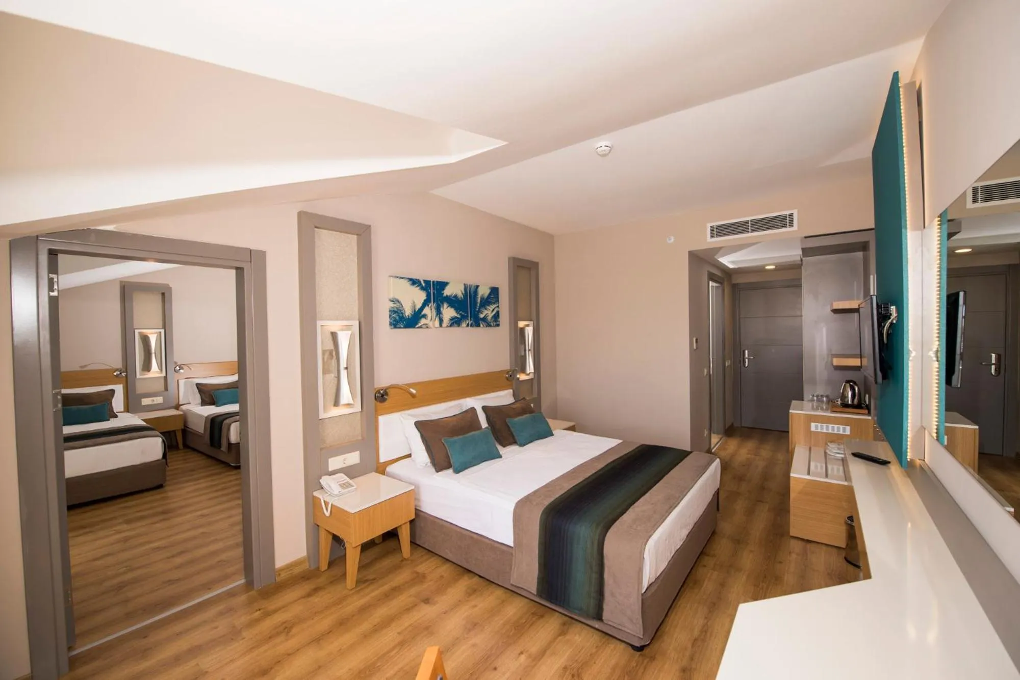 Bed in Palm World Side Resort &amp; Spa