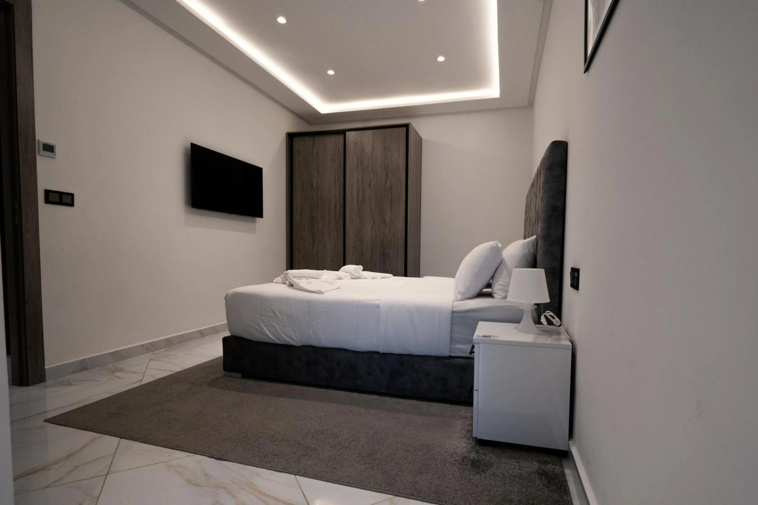 Bed in Amelia Appart-Hotel