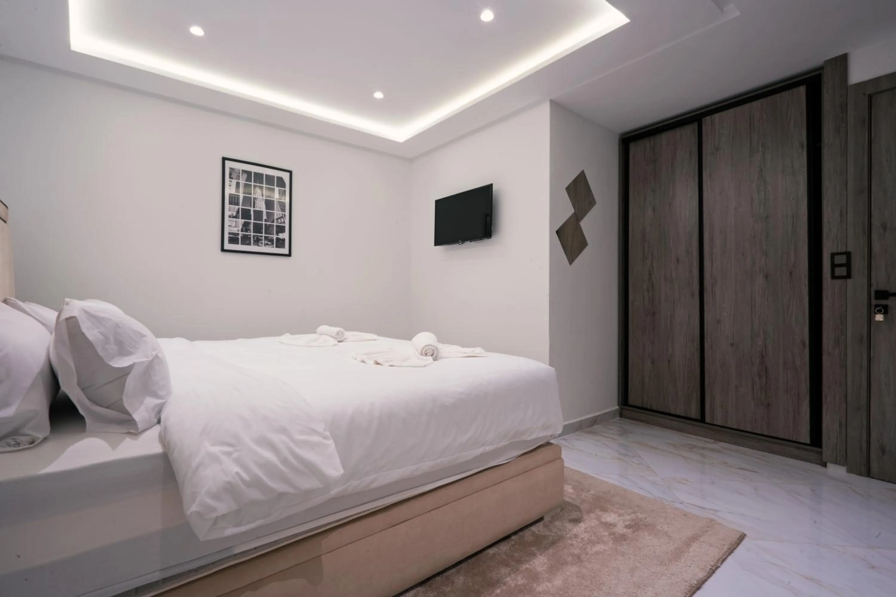 Bed in Amelia Appart-Hotel