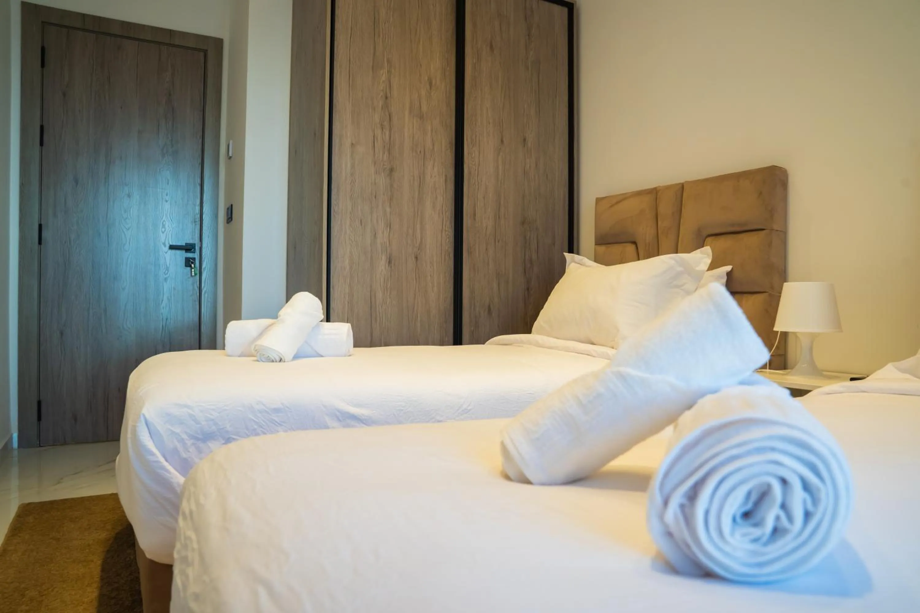 Bed in Amelia Appart-Hotel