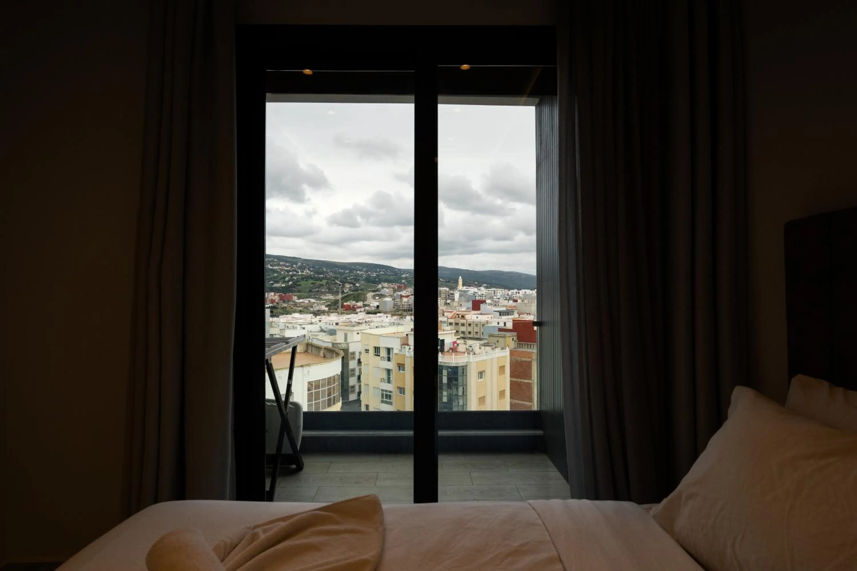 Bed in Amelia Appart-Hotel