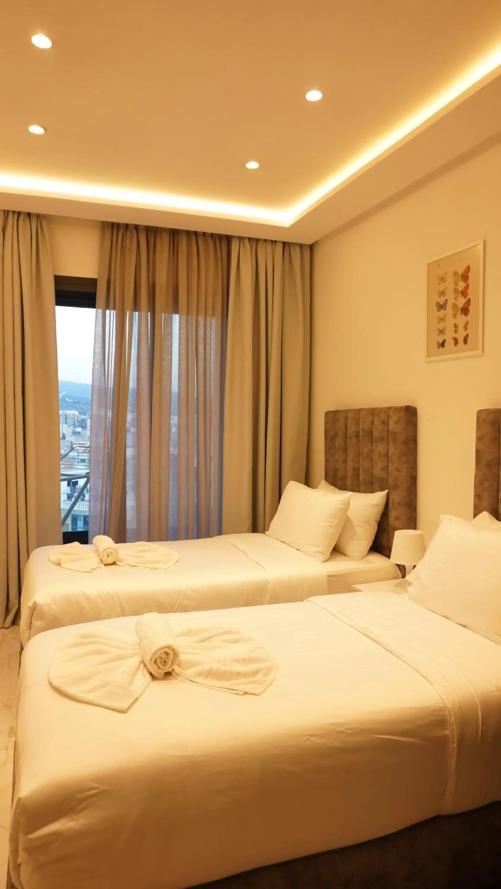 Bed in Amelia Appart-Hotel