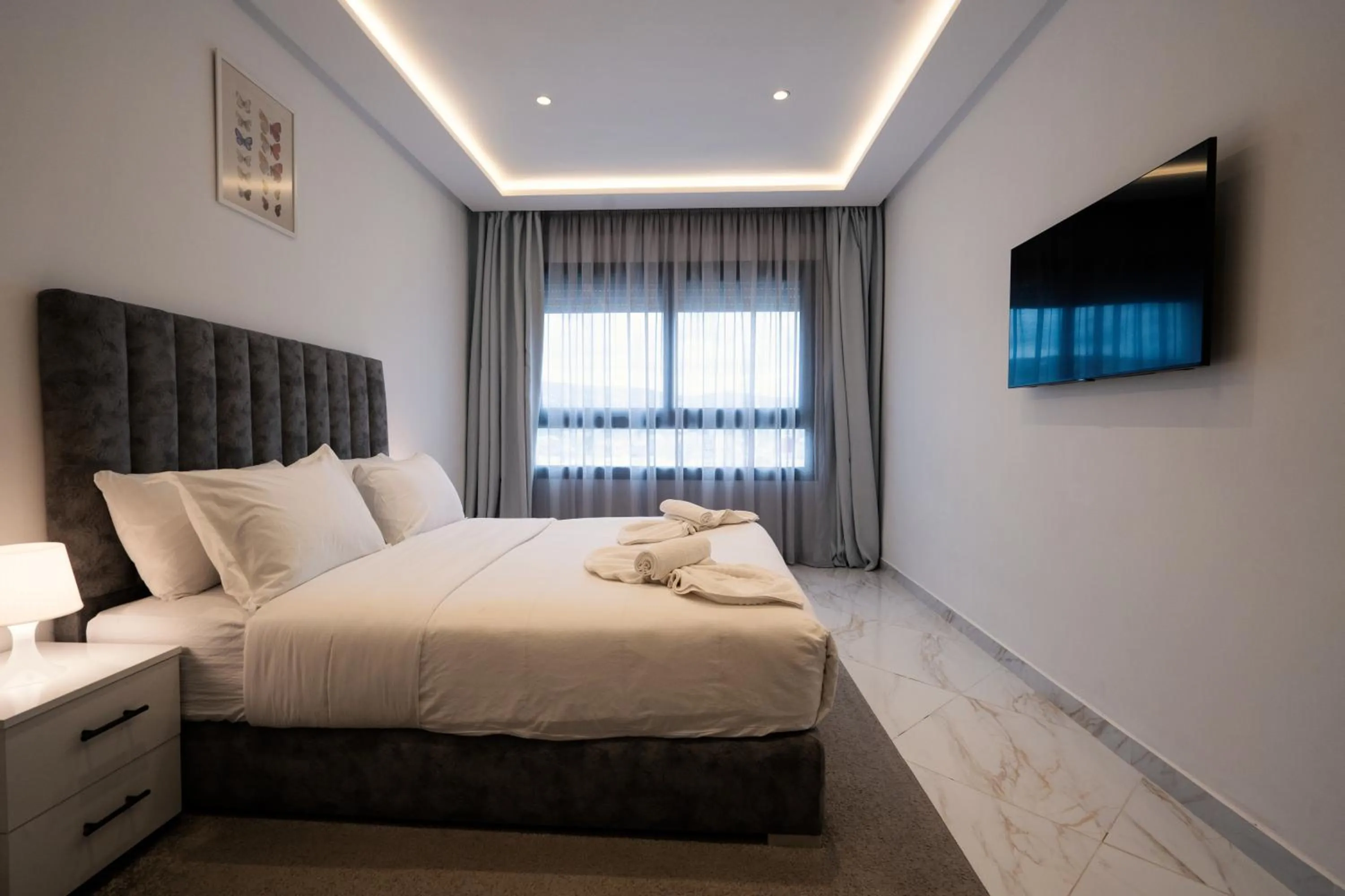 Bed in Amelia Appart-Hotel