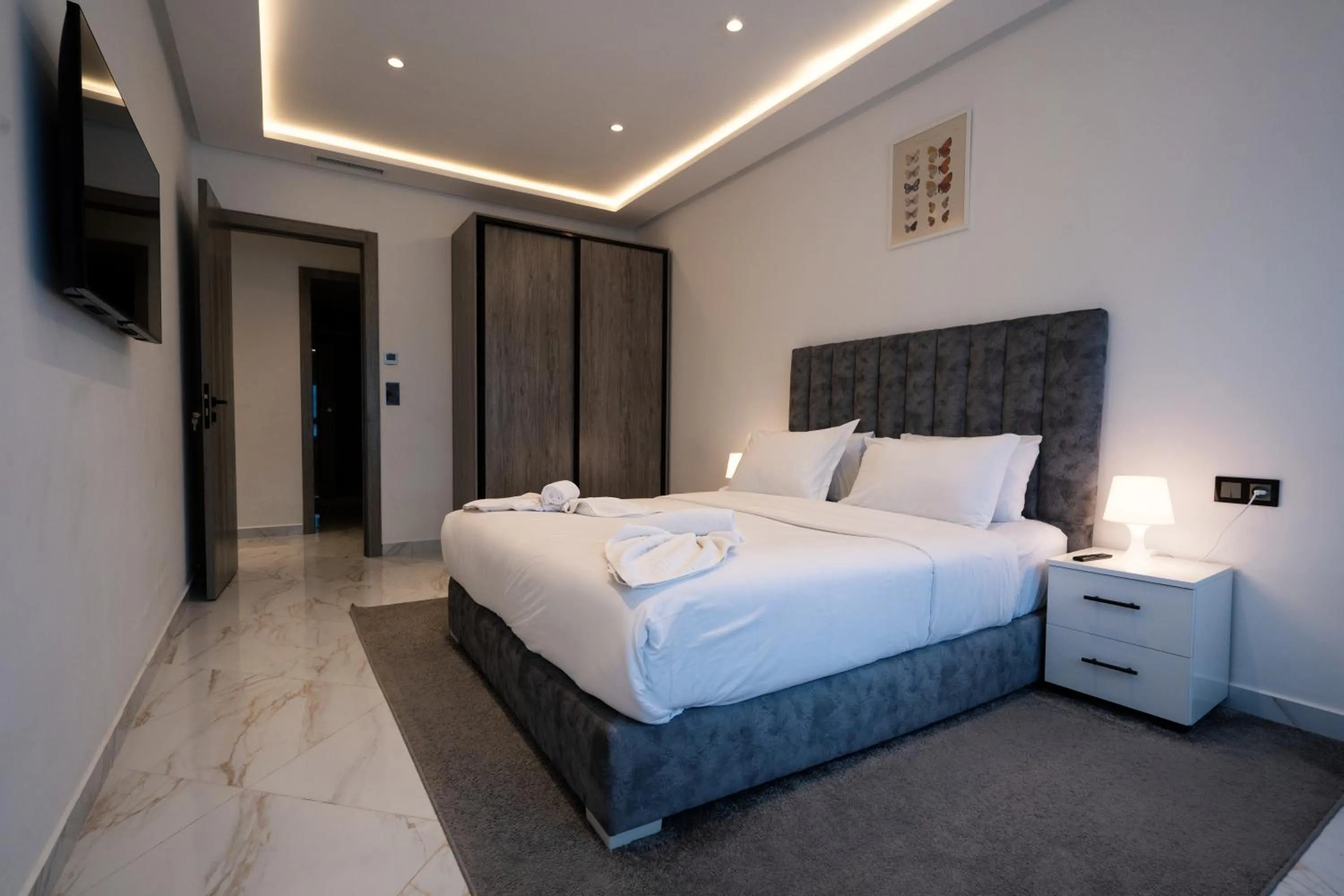 Bed in Amelia Appart-Hotel