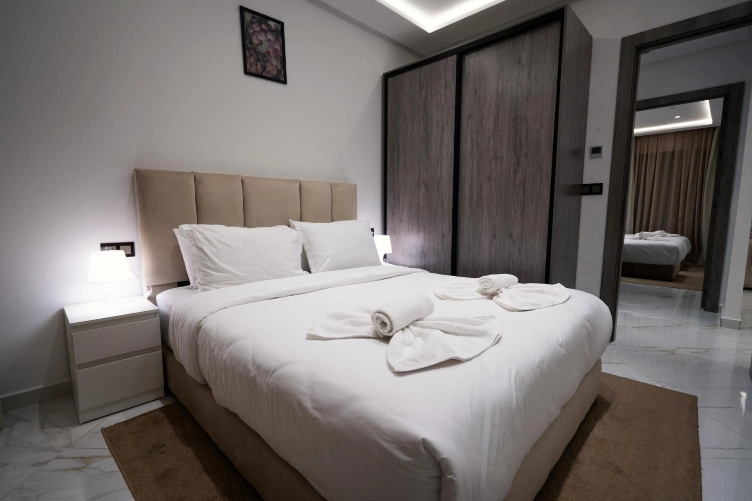 Bed in Amelia Appart-Hotel