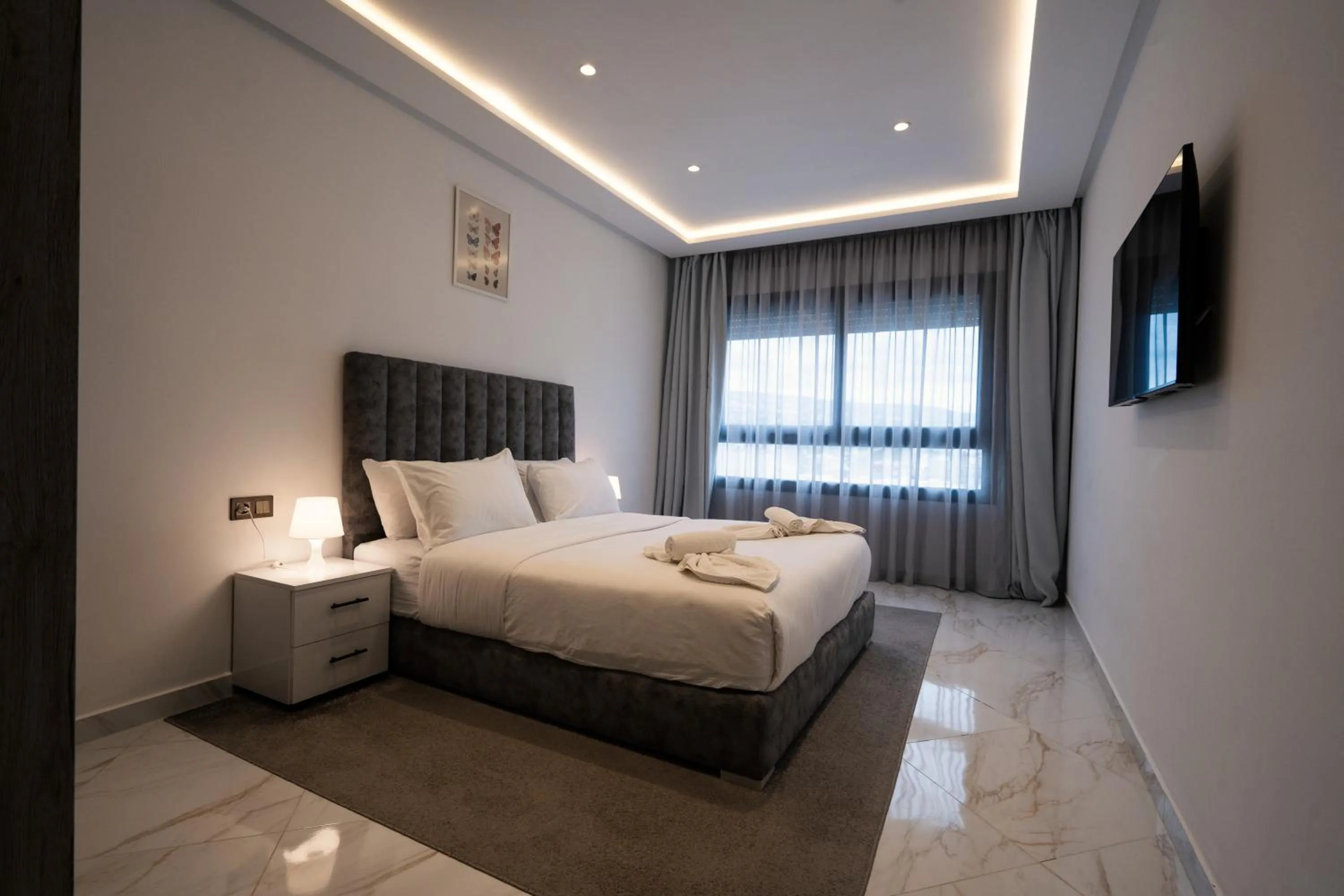 Bed in Amelia Appart-Hotel