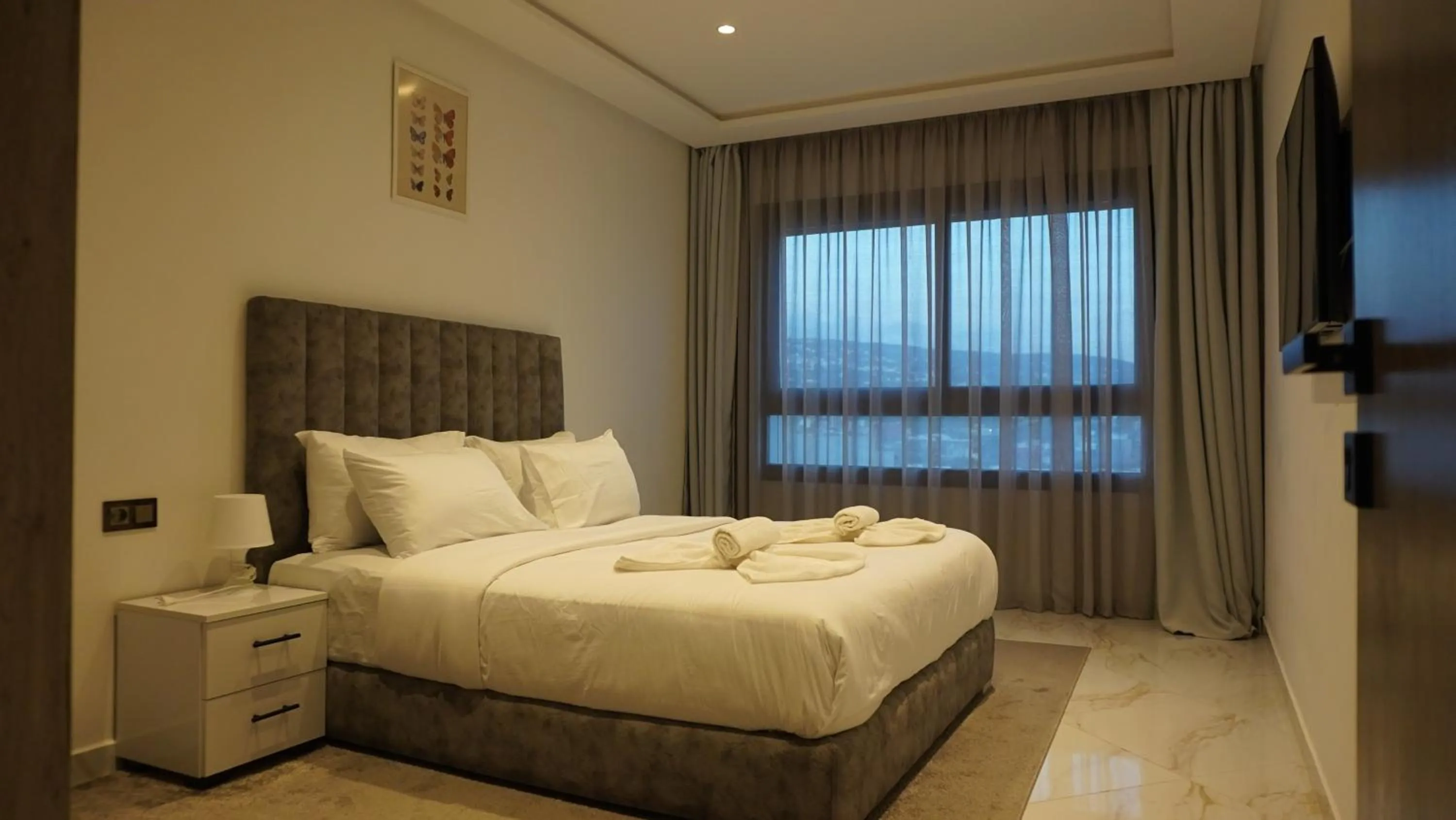 Bed in Amelia Appart-Hotel