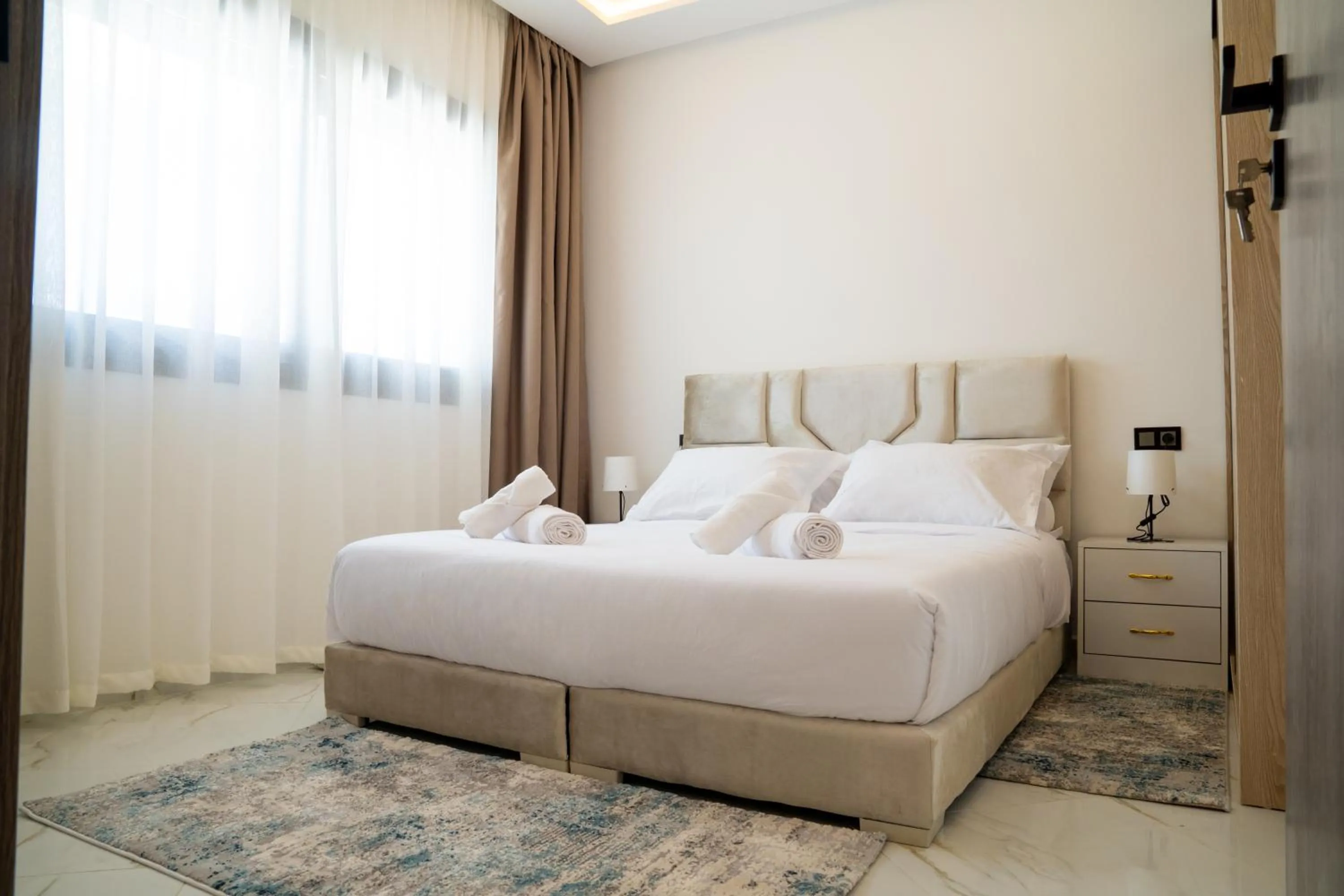 Bed in Living Appart-Hotel