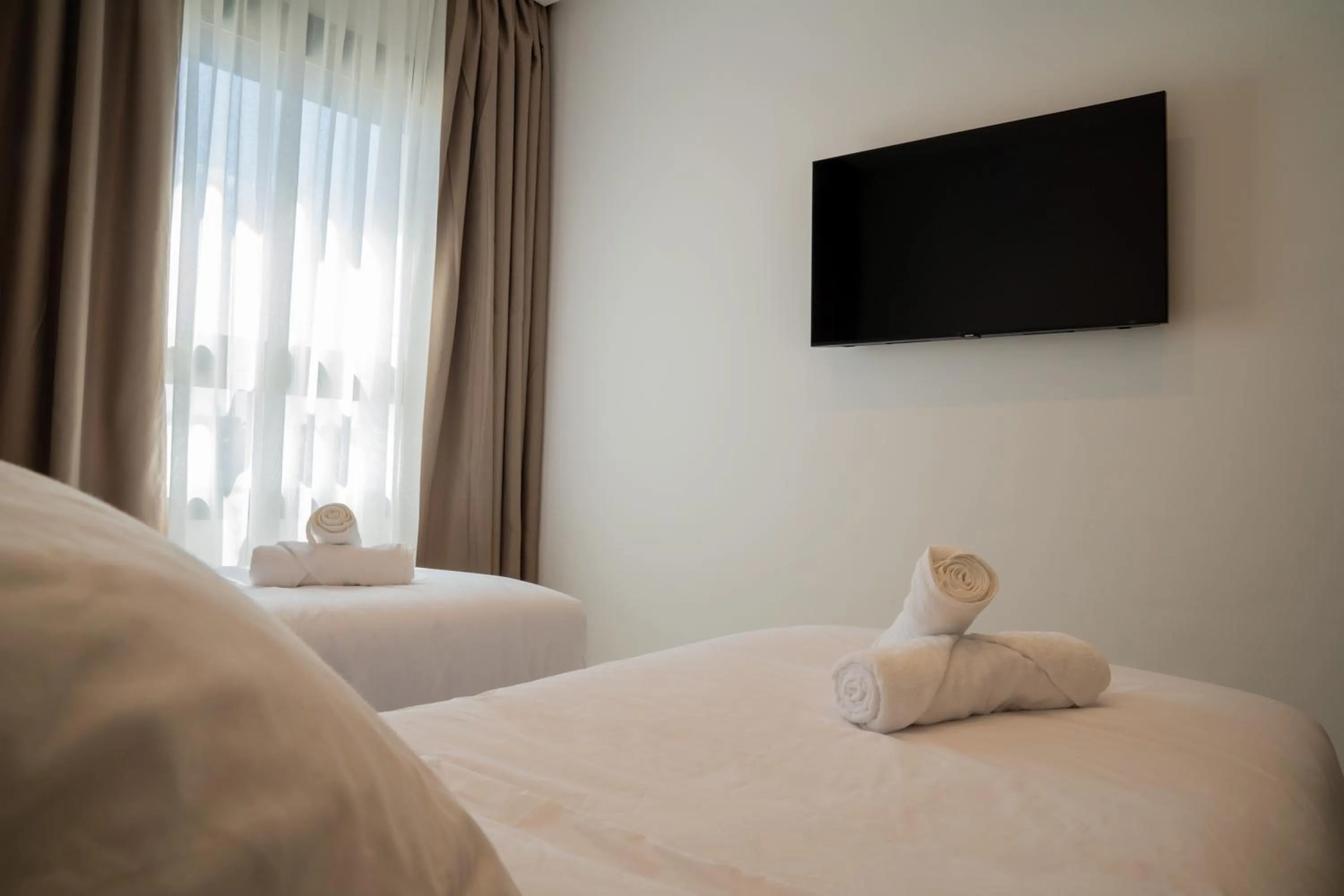 Bed in Living Appart-Hotel