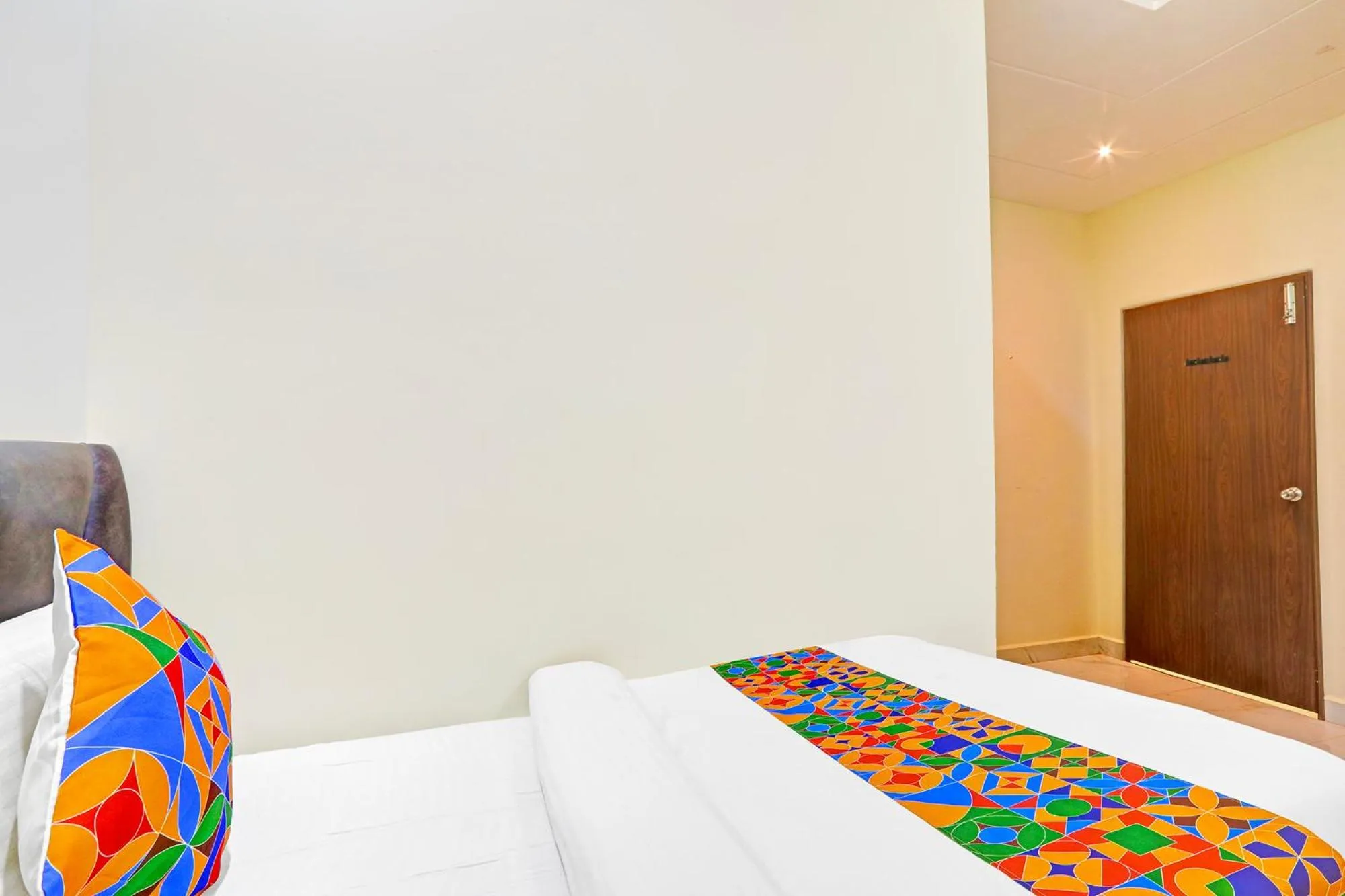 Bed in FabHotel Dharani Grand - Nr Mamata Medical College