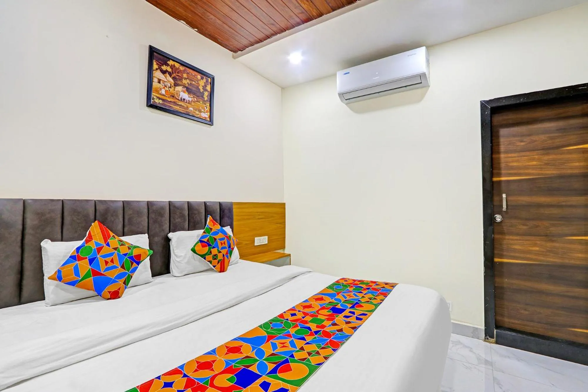Bed in FabHotel Dharani Grand - Nr Mamata Medical College