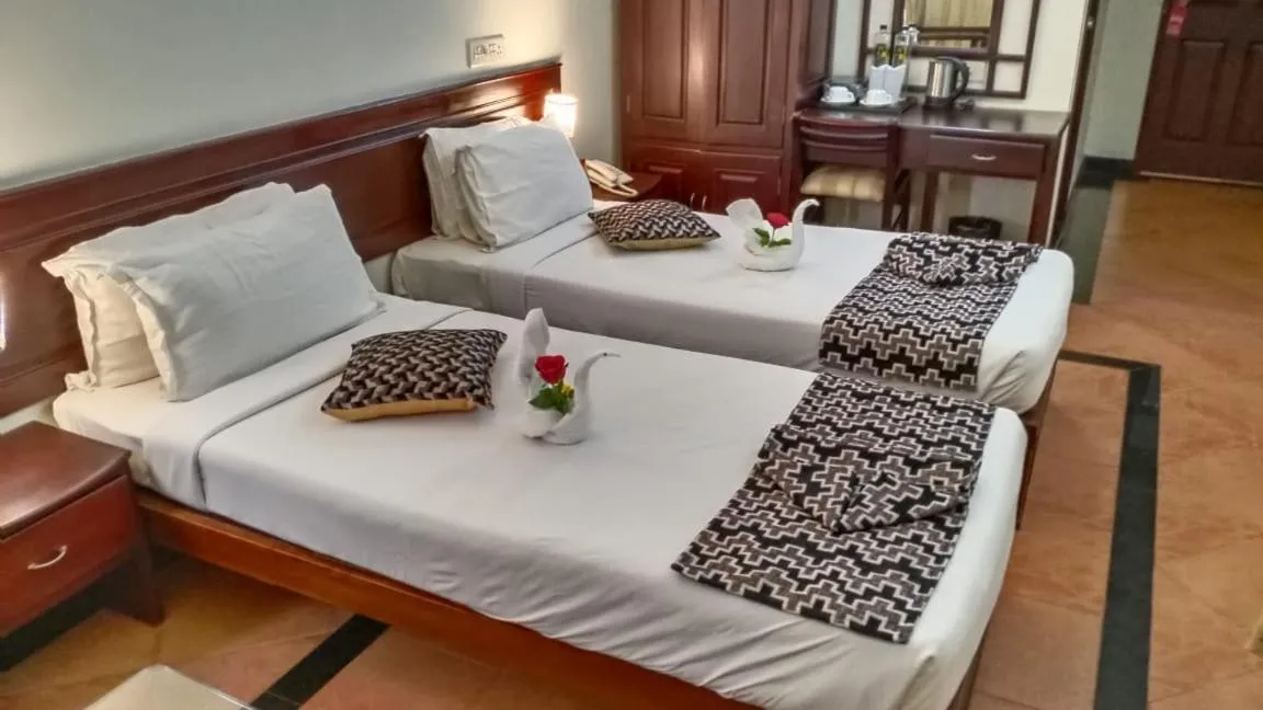 Bed in Hotel Afrad International