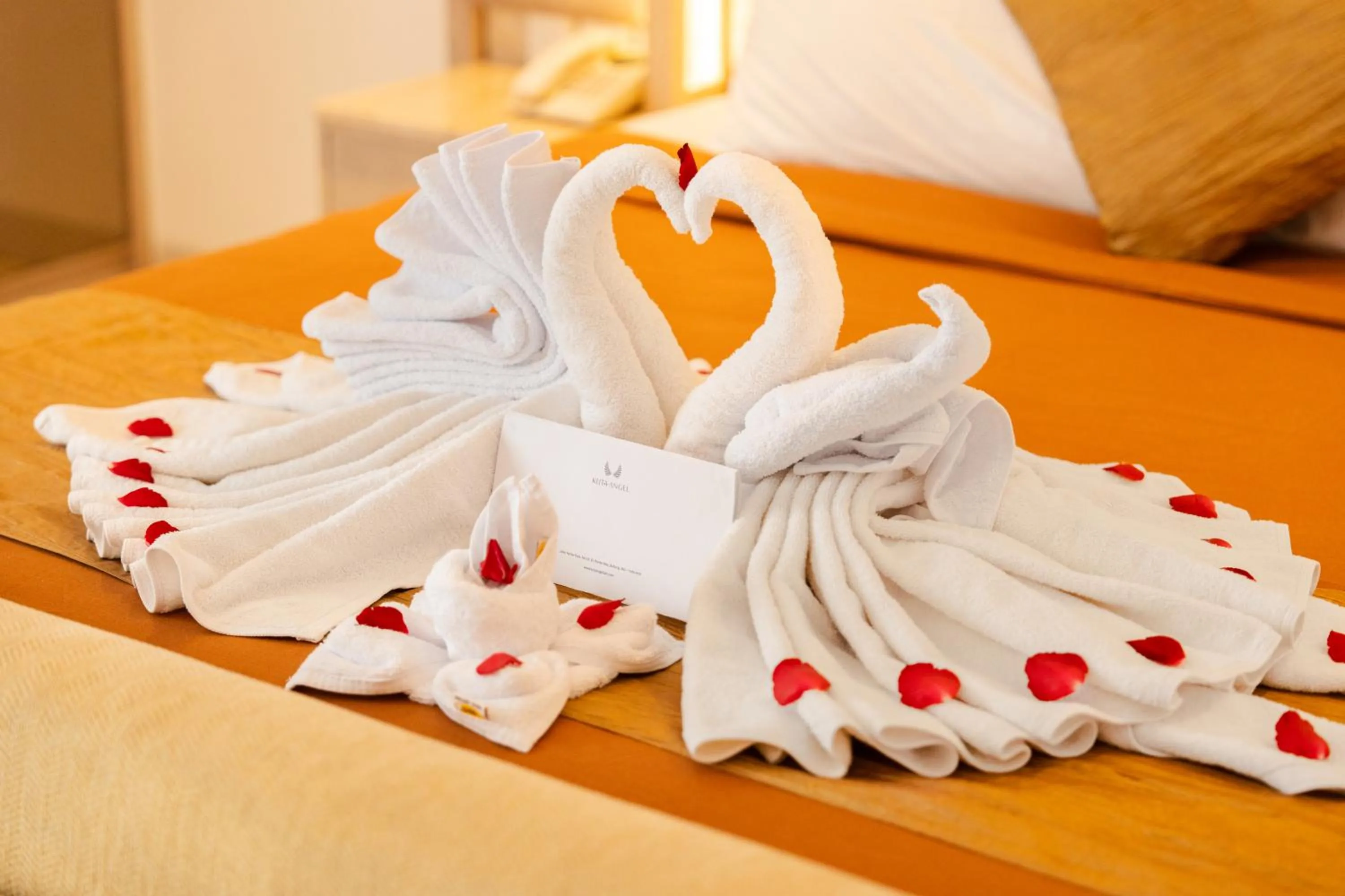 towels, Bed in Kuta Angel Hotel