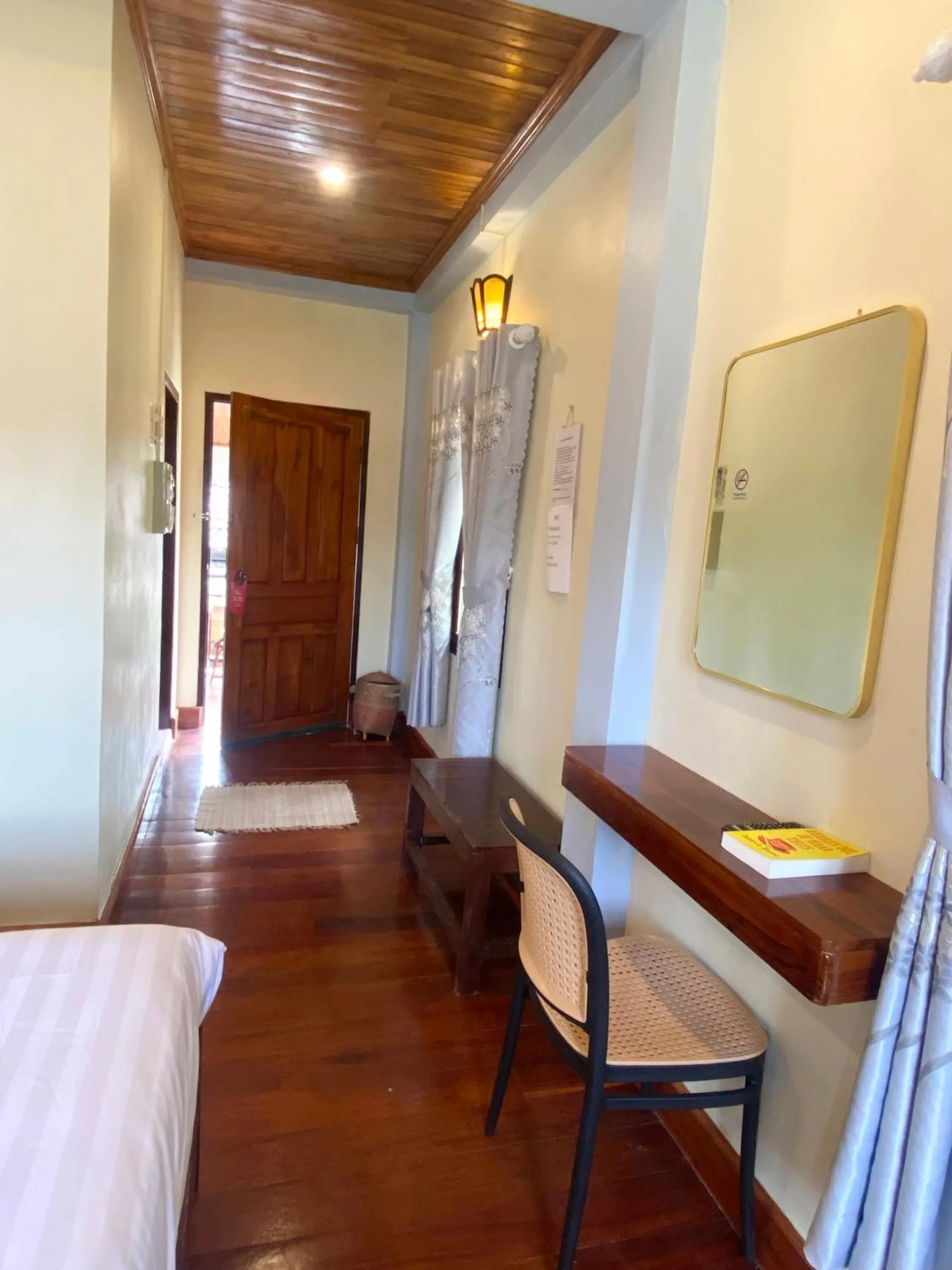 Seating area, Bed in Golden Sun Hotel