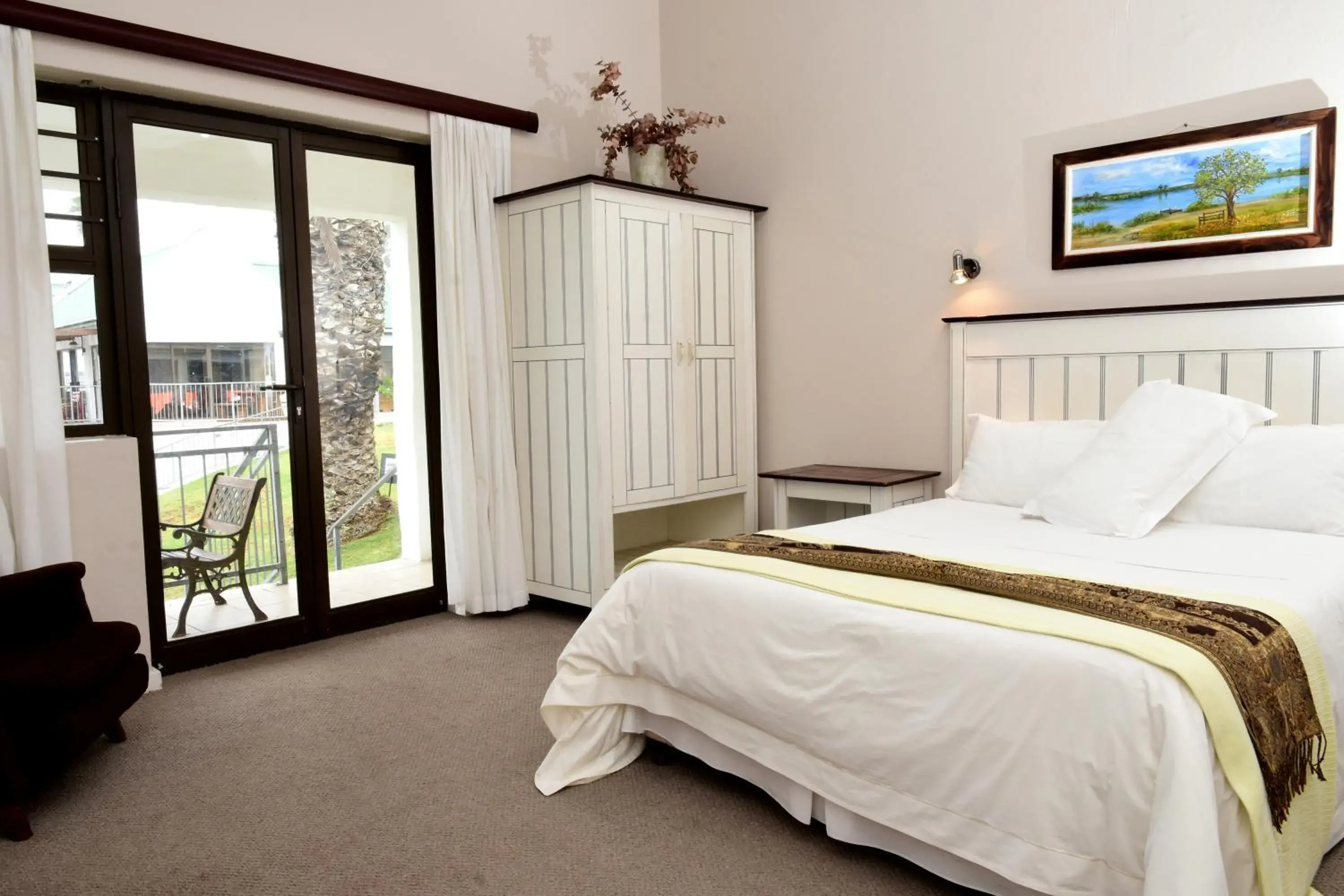 Garden view, Bed in Riviera Hotel & Chalets Garden view, Bed in Riviera Hotel & Chalets