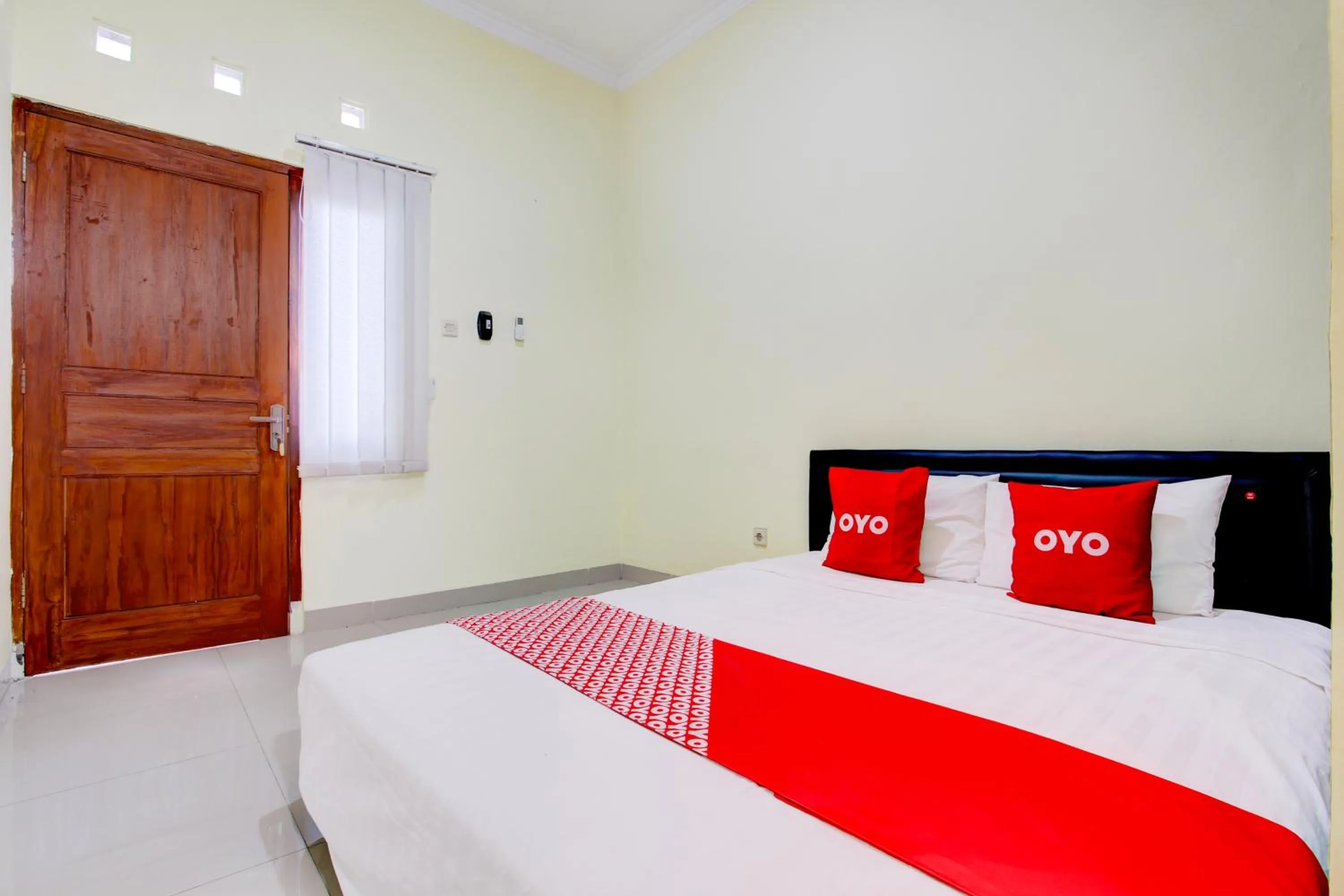 Photo of the whole room, Bed in Hotel O Sleman Near Bandara Adi Sutjipto Formerly Joglo Sorogenen