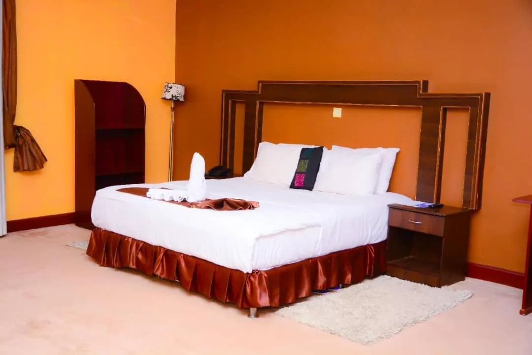 Bed in The Country Inn Hotel