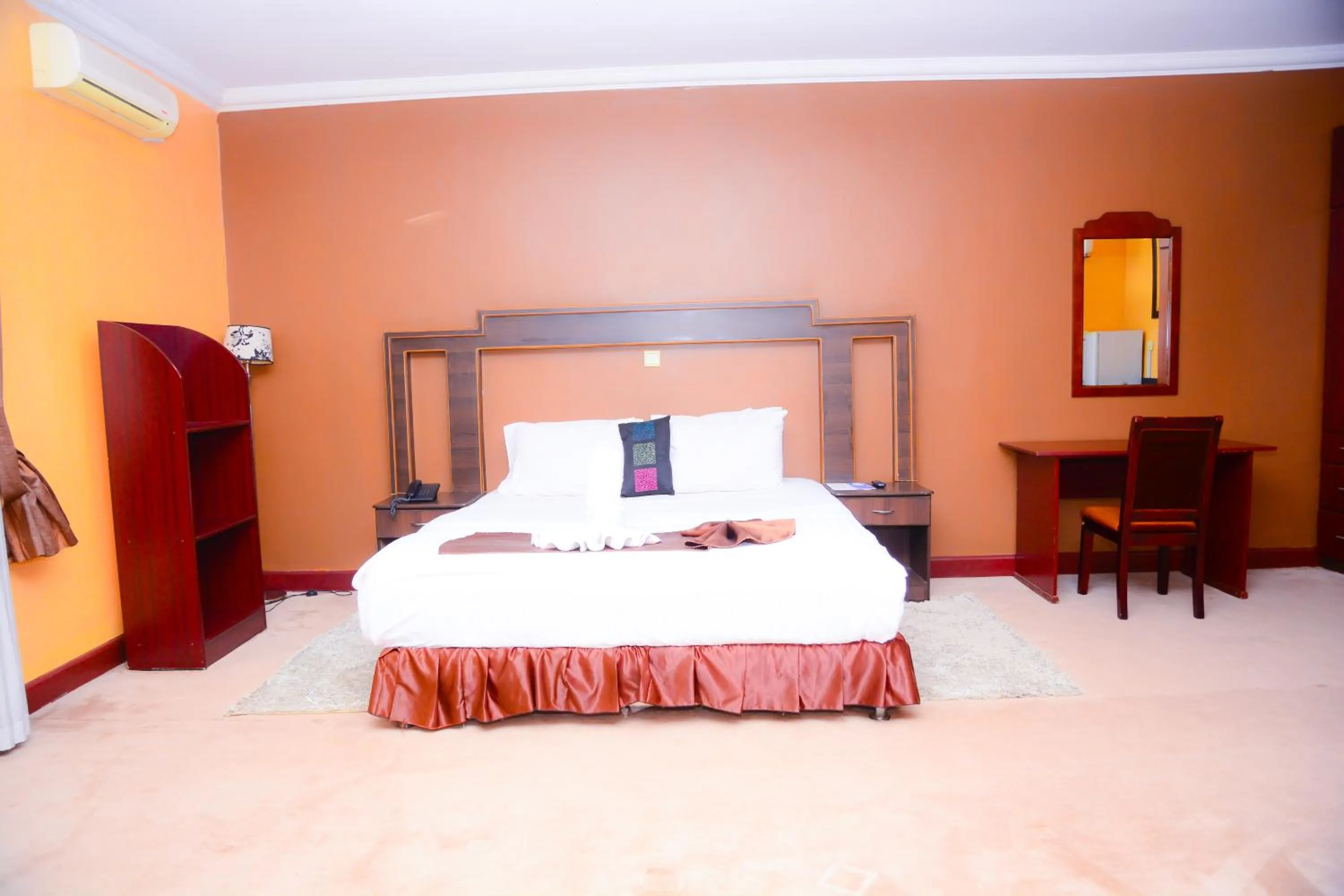 Bed in The Country Inn Hotel