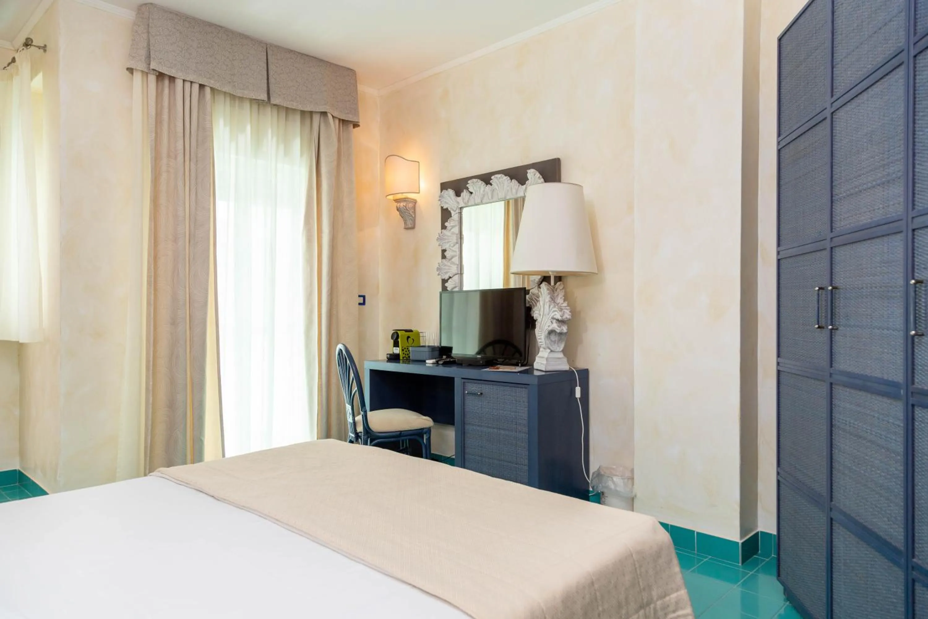 Bed in AH Premium Baia dei Faraglioni