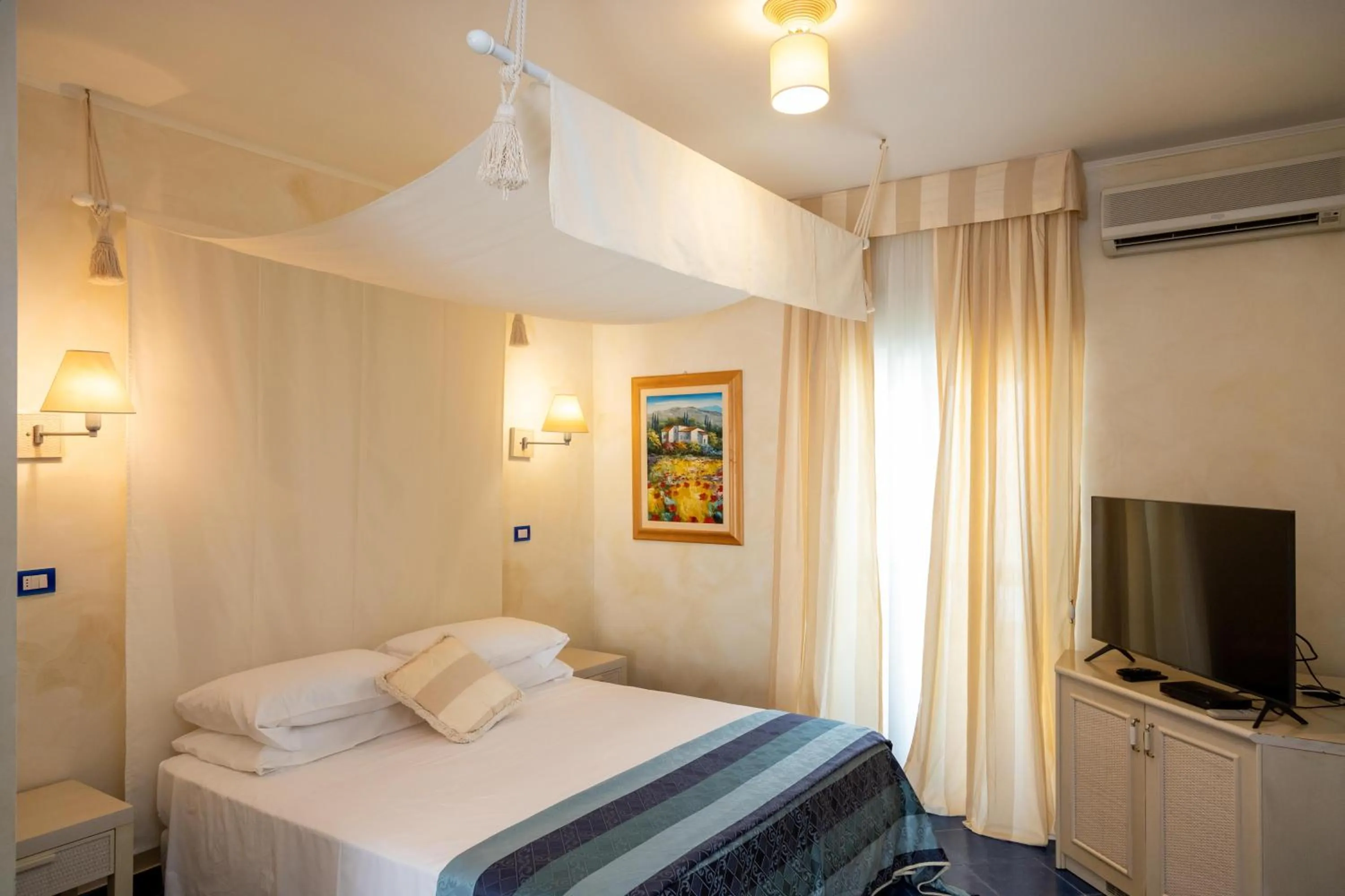 Bed in AH Premium Baia dei Faraglioni