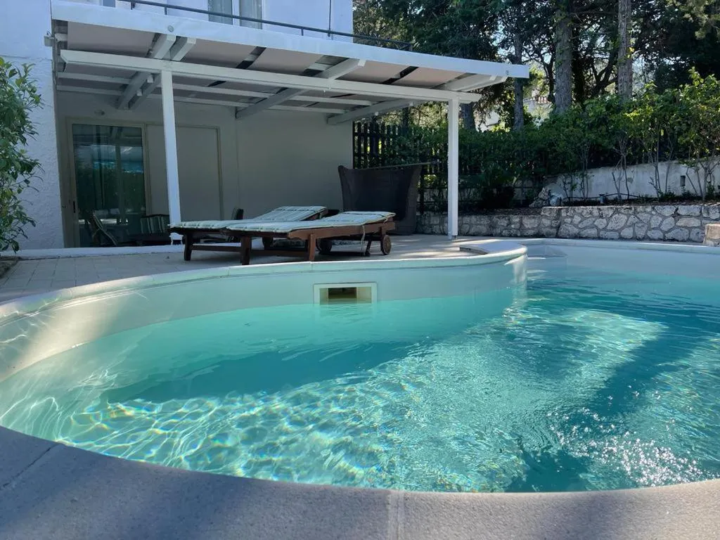 Swimming pool in AH Premium Baia dei Faraglioni