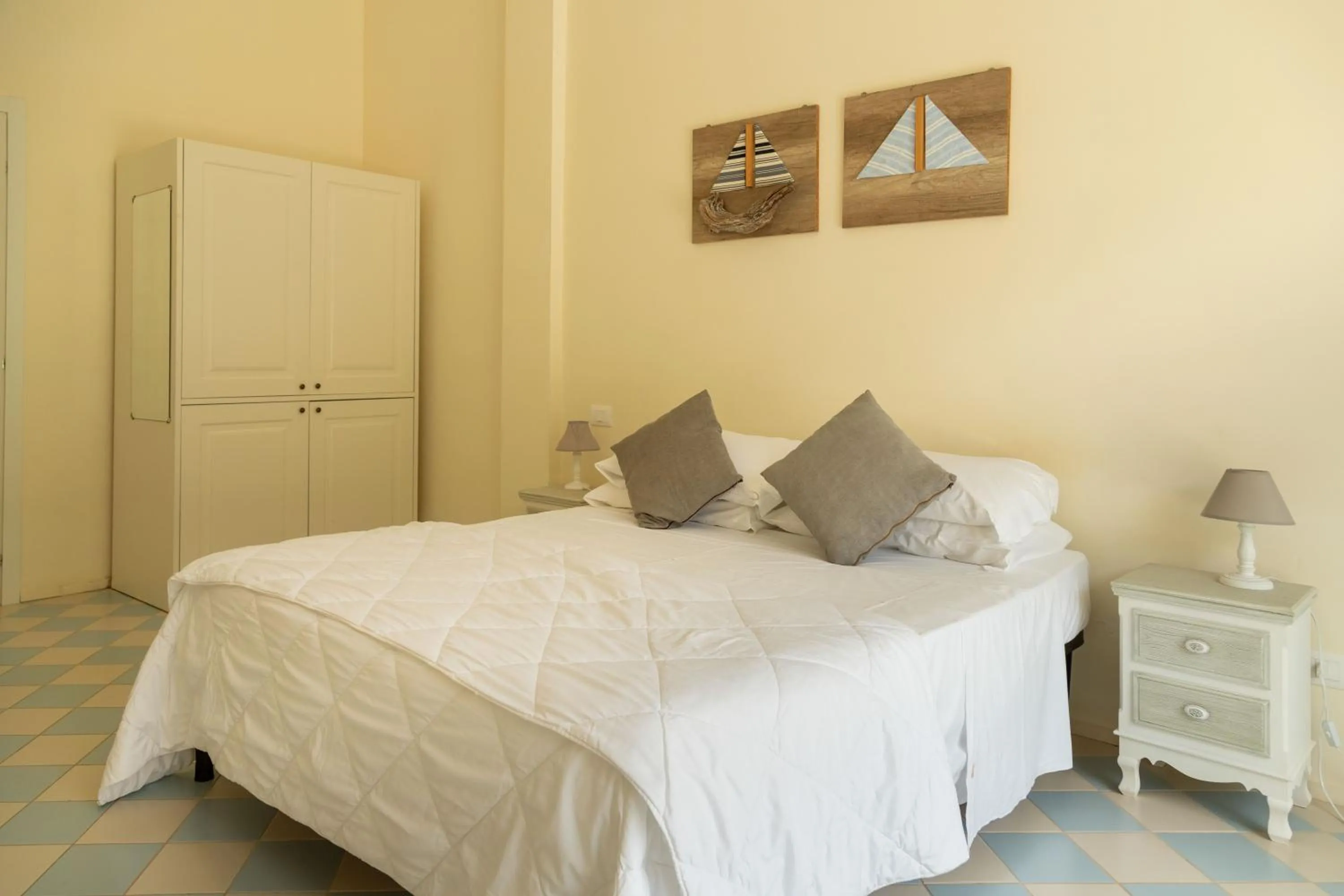 Bed in AH Premium Baia dei Faraglioni